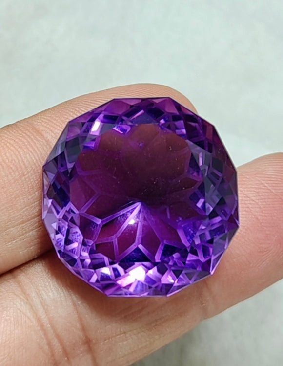 An amazing faceted fancy cut amethyst gemstone 77 carats