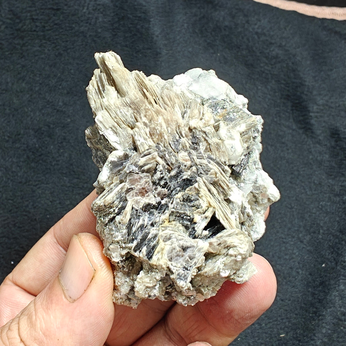 Natural spessartine garnet embedded in muscovite, with albite 150 grams