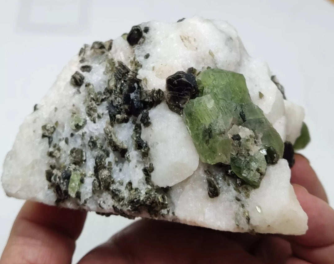 Diopside crystals on matrix with black/dark brown mica 811 grams