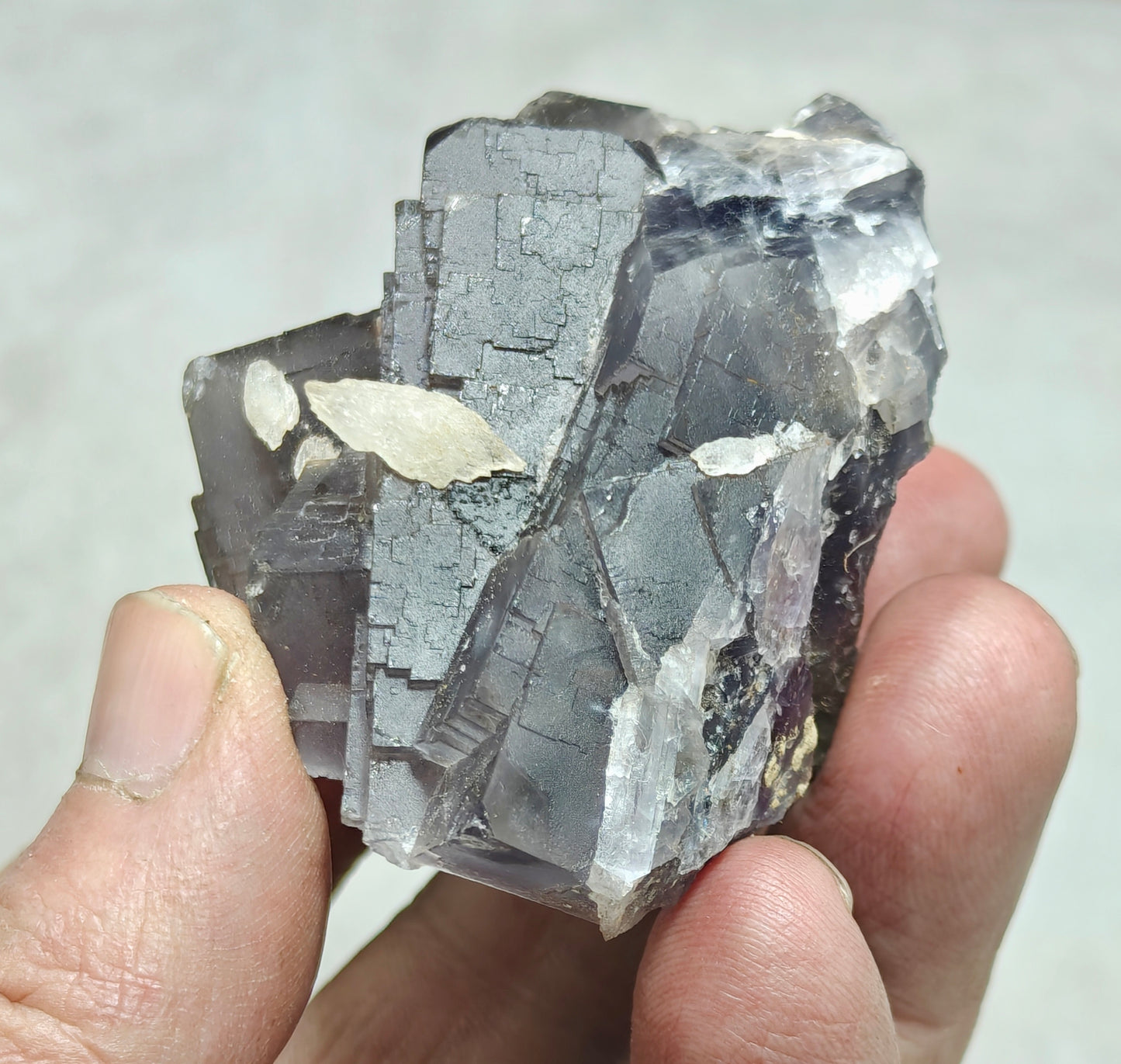 An amazing Single beautiful specimen of grey/purple fluorite with calcite crystals 150 grams
