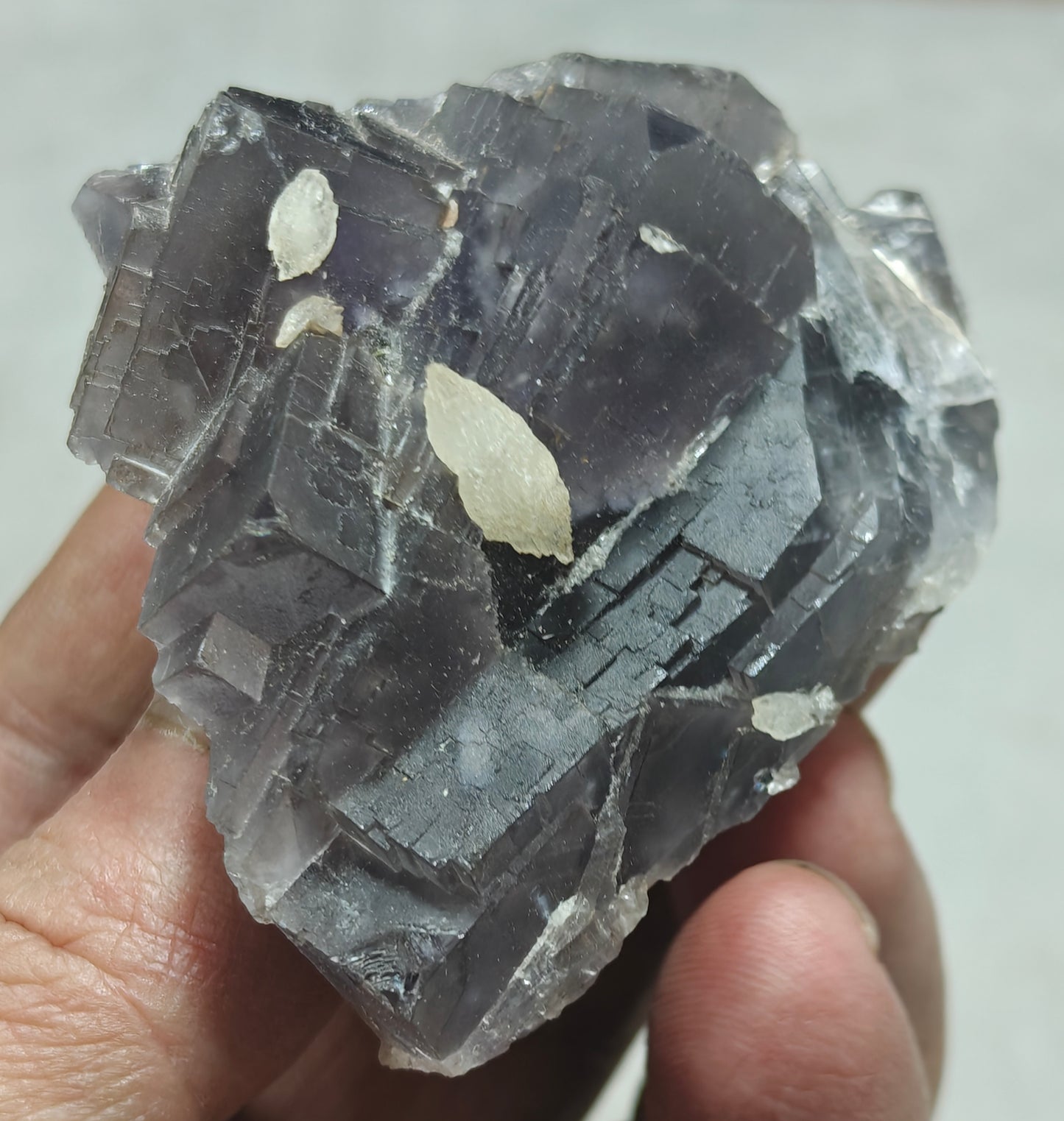 An amazing Single beautiful specimen of grey/purple fluorite with calcite crystals 150 grams