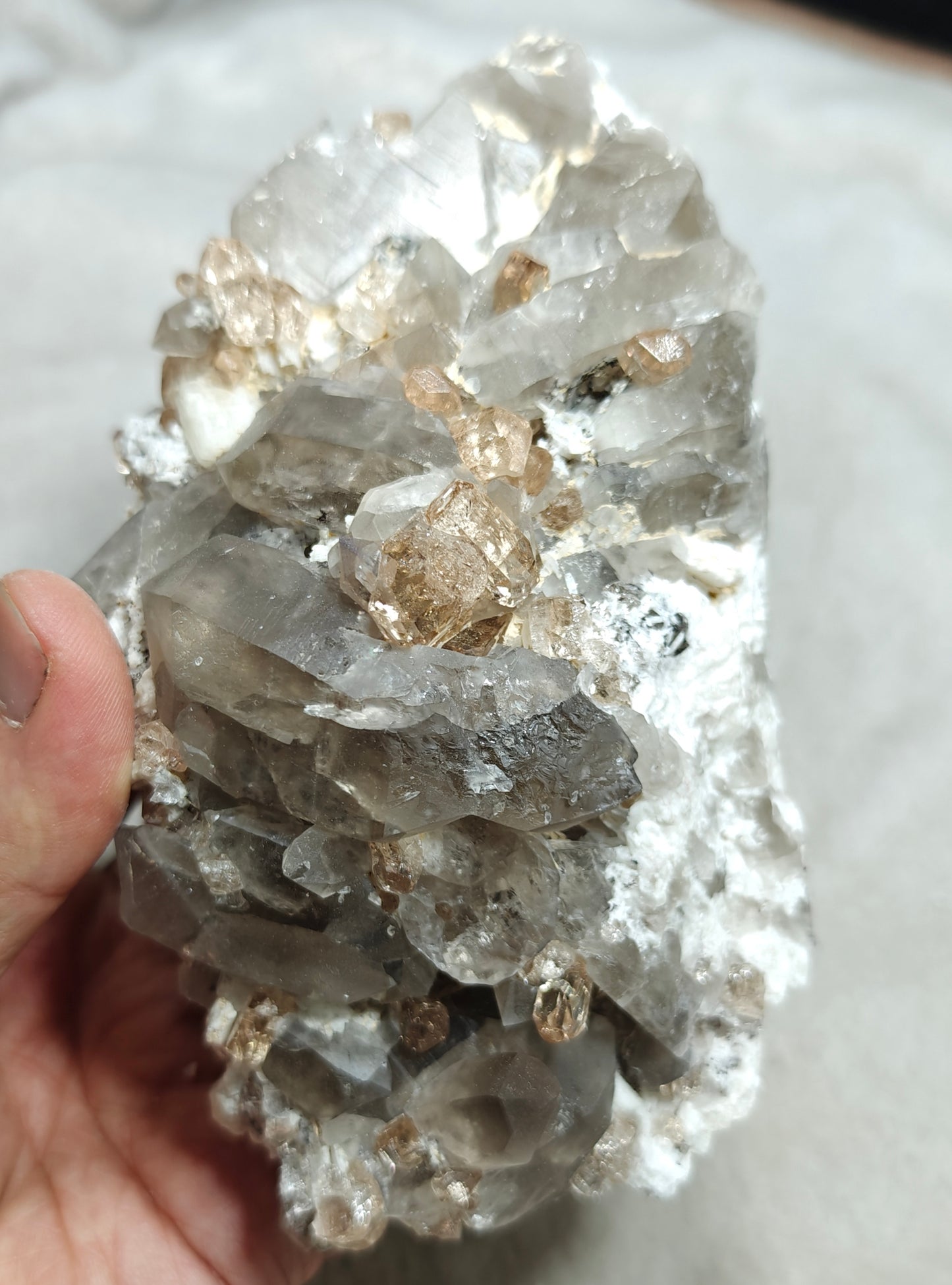 Natural terminated peach color Topaz crystals with smoky quartz on matrix 750 grams