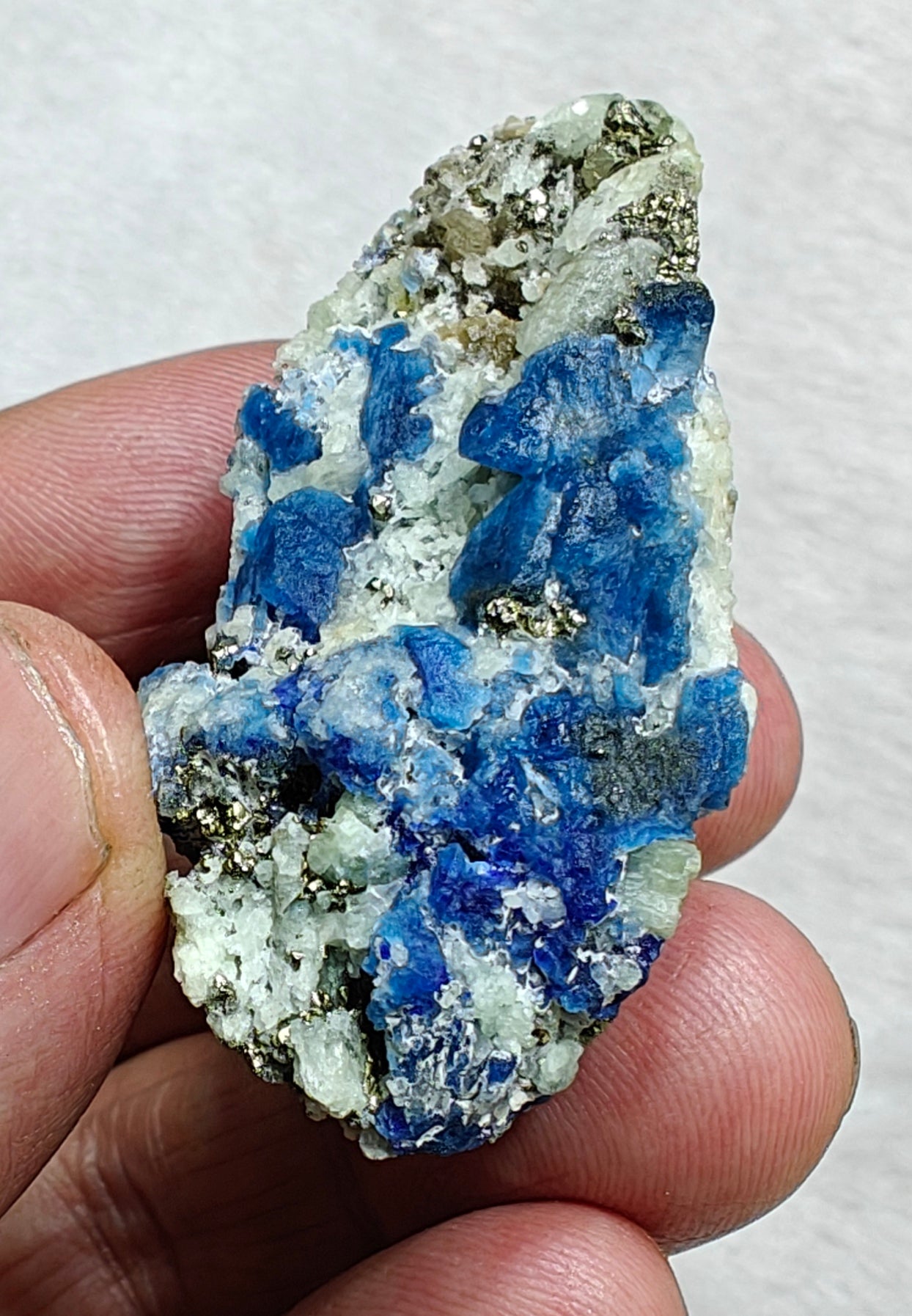 Afghanite Fluorescent in matrix with some pyrite and phlogopite 41 grams