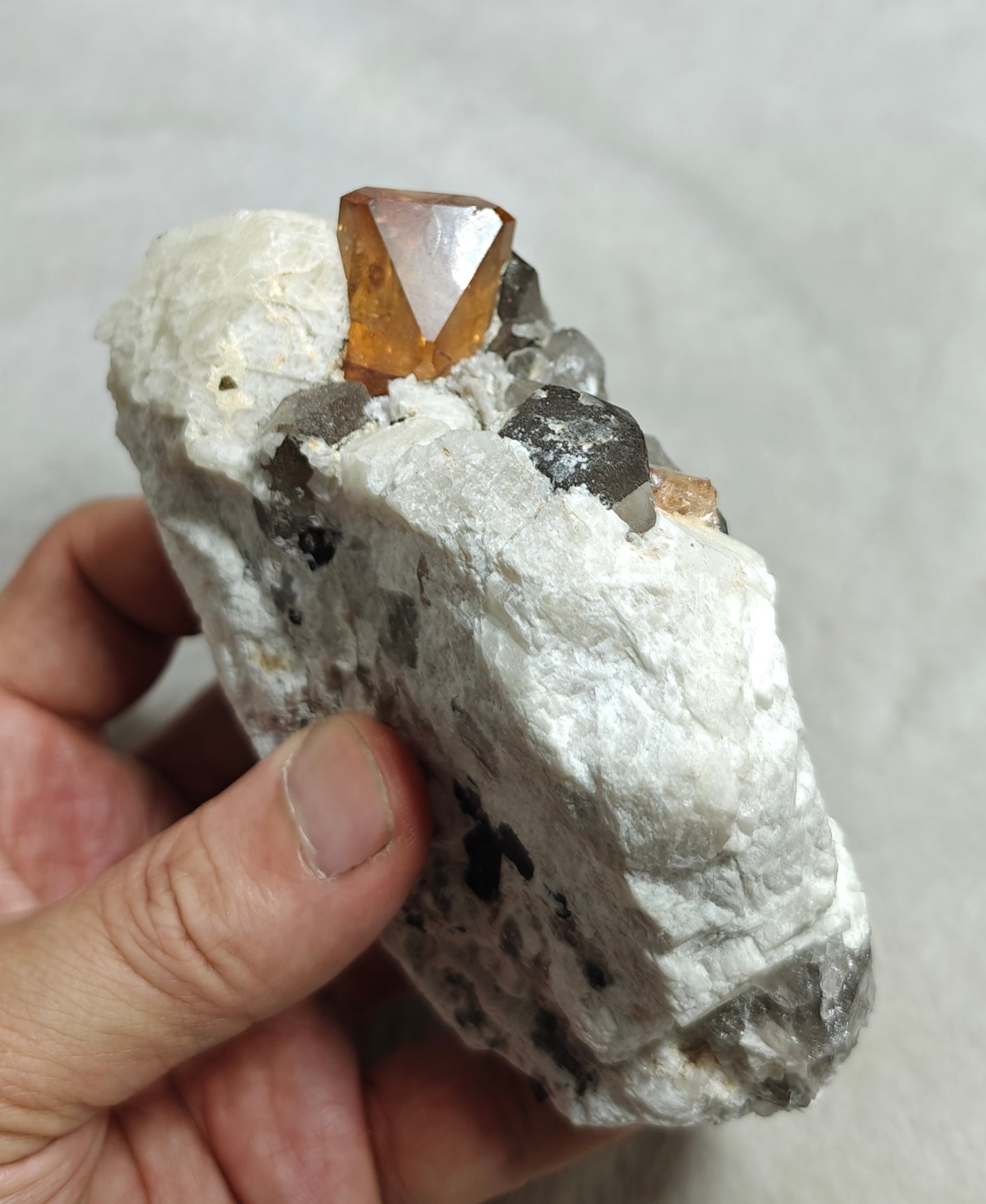 Terminated peach color Topaz crystal on matrix 576 grams