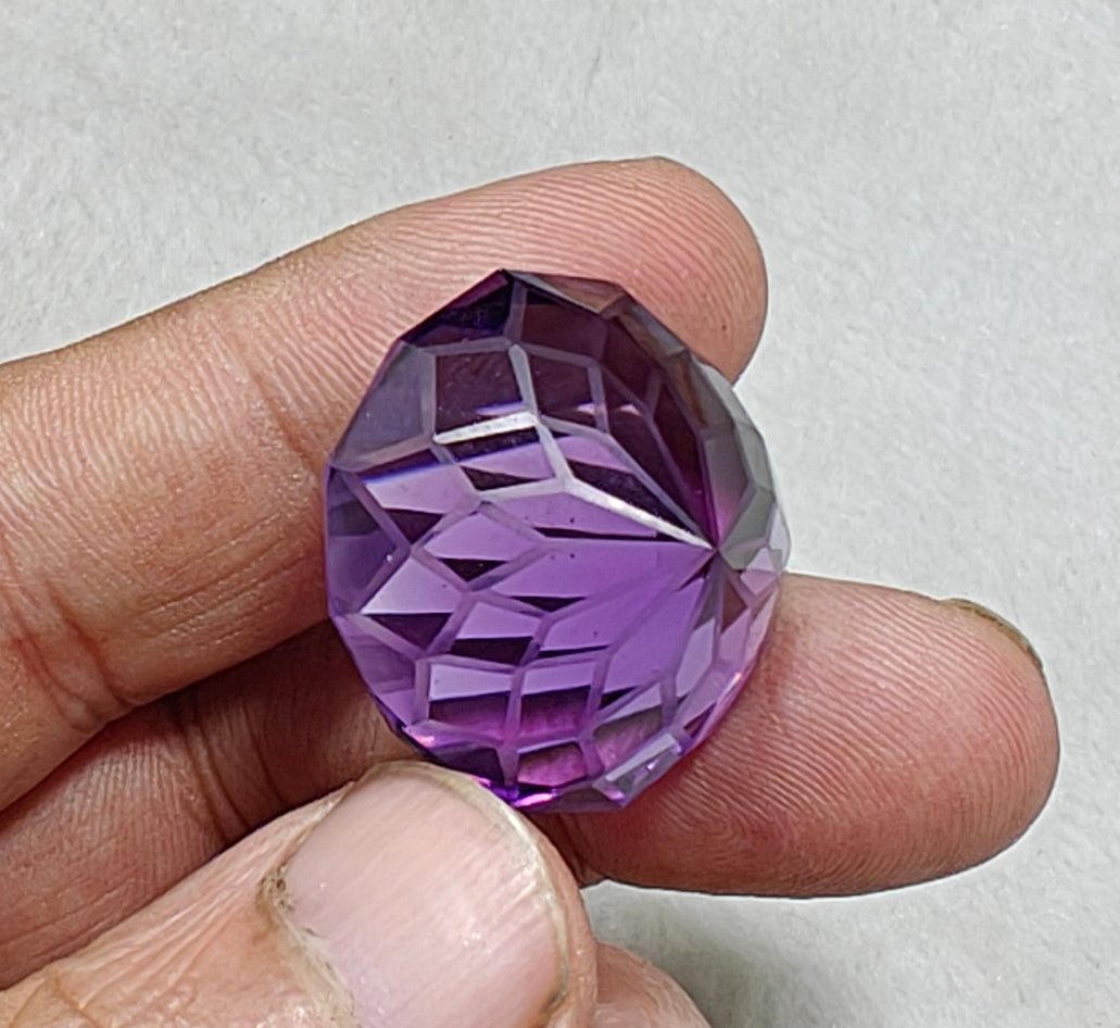 An amazing faceted fancy cut amethyst gemstone 77 carats