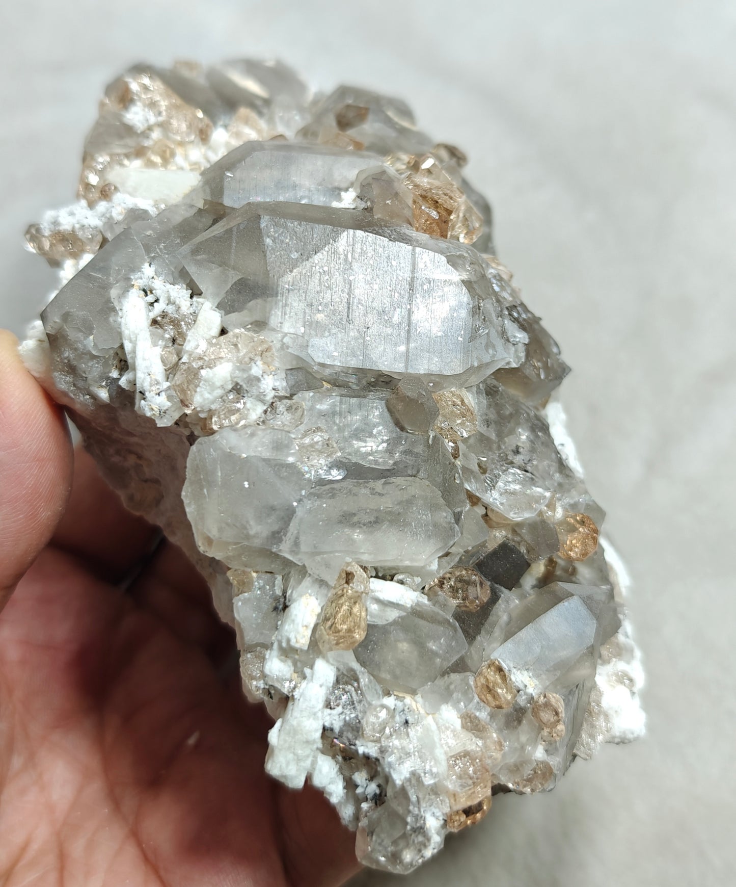 Natural terminated peach color Topaz crystals with smoky quartz on matrix 750 grams