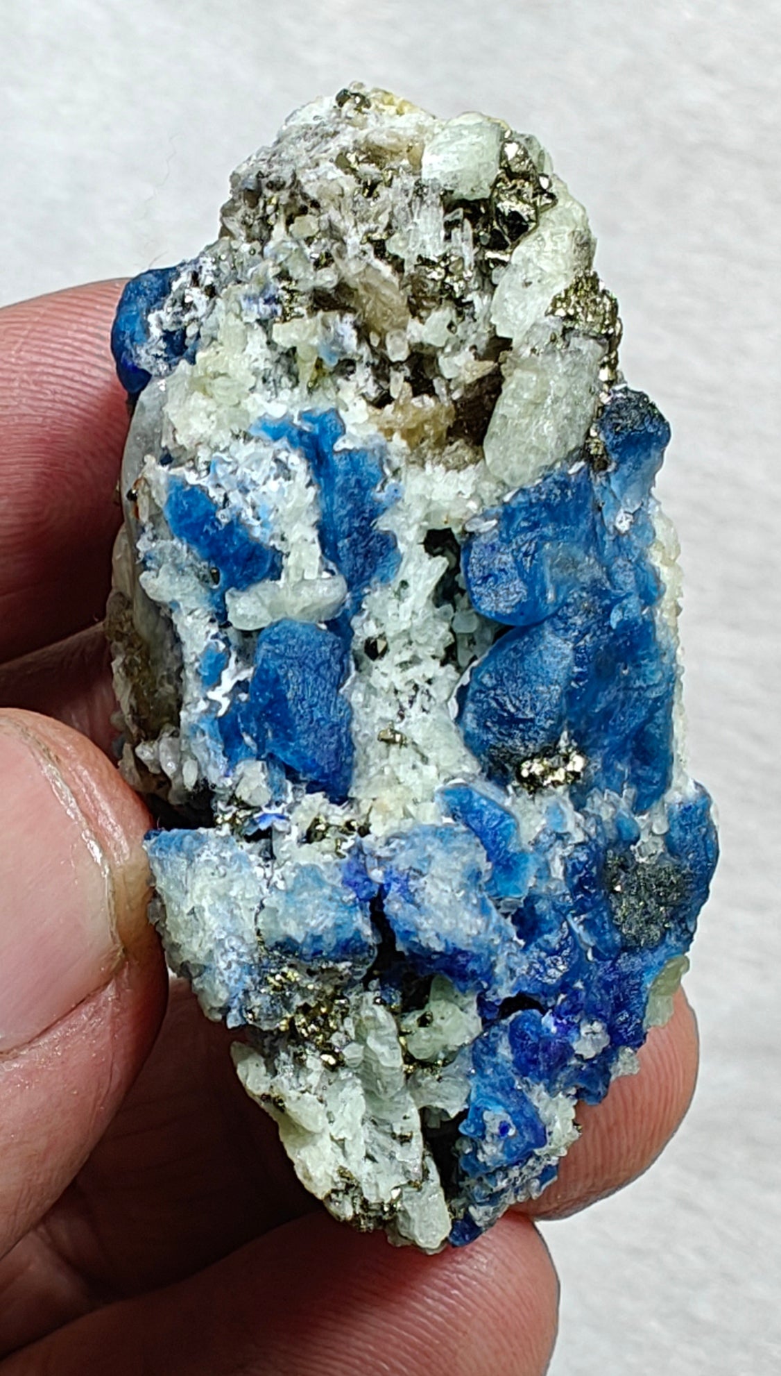Afghanite Fluorescent in matrix with some pyrite and phlogopite 41 grams