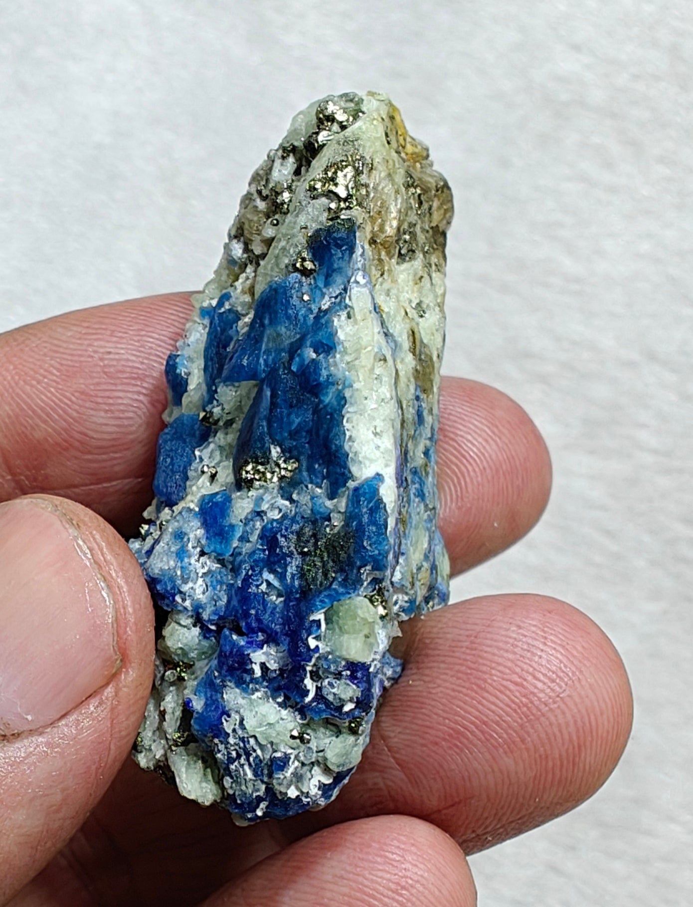 Afghanite Fluorescent in matrix with some pyrite and phlogopite 41 grams