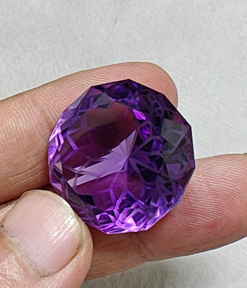 An amazing faceted fancy cut amethyst gemstone 77 carats