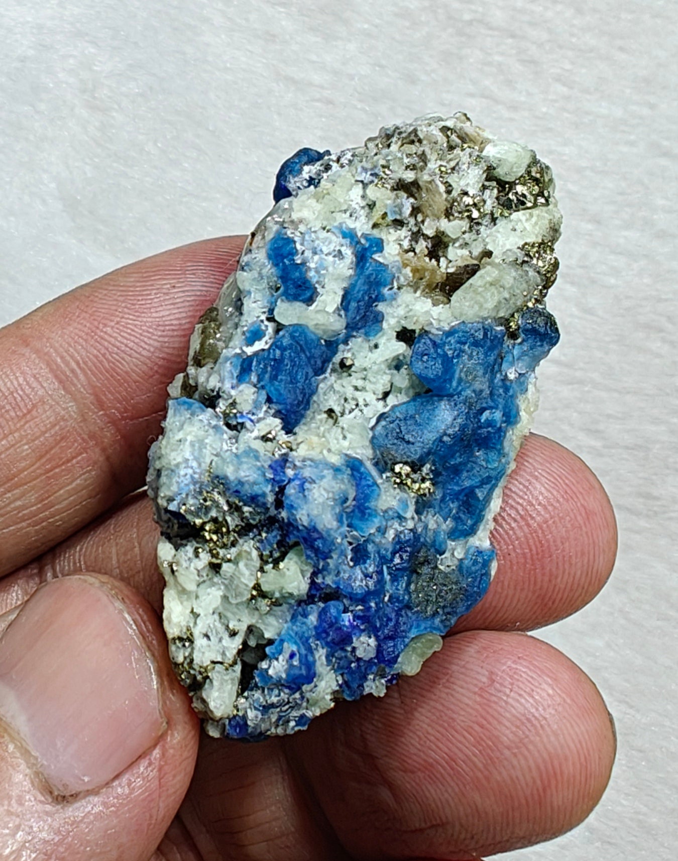 Afghanite Fluorescent in matrix with some pyrite and phlogopite 41 grams