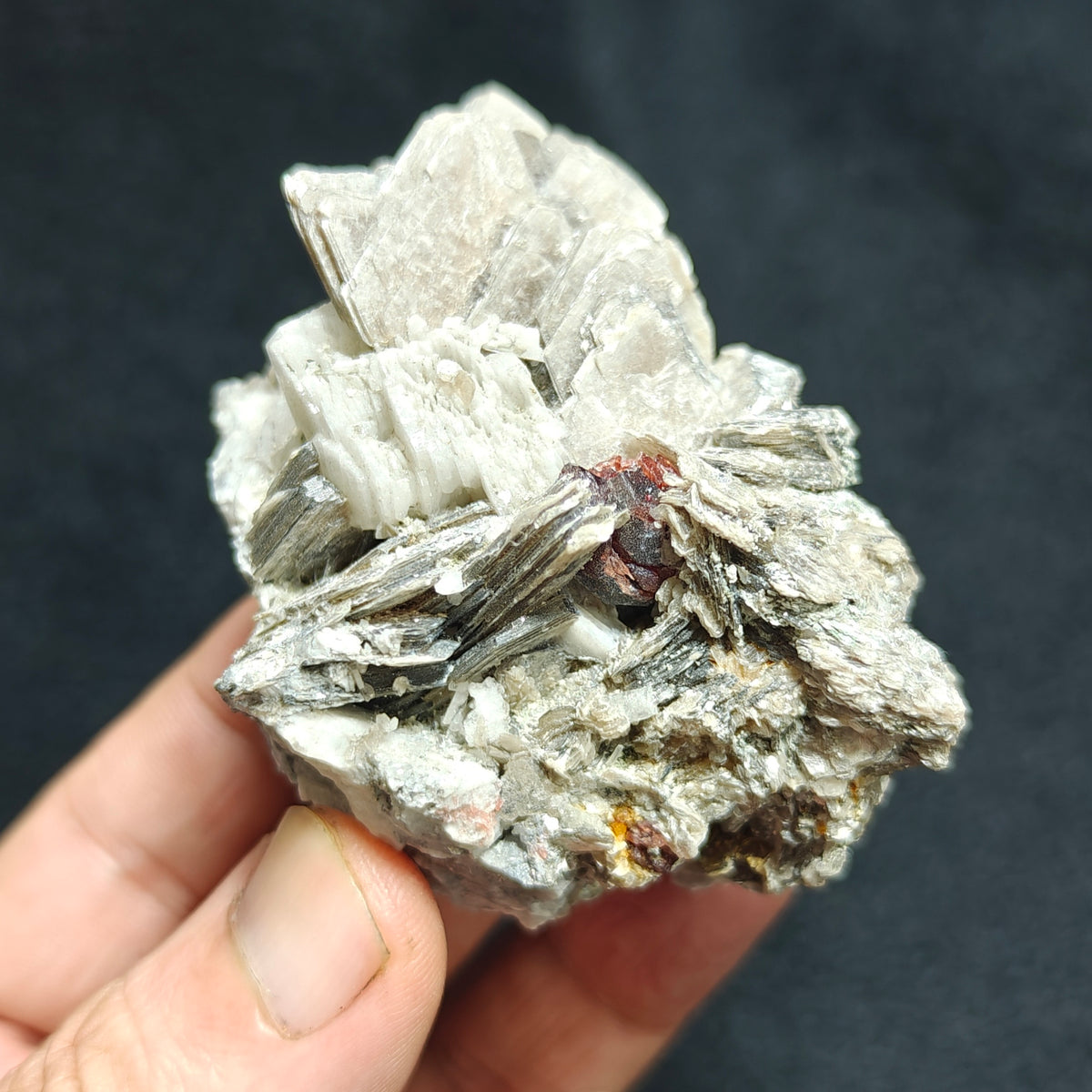 Natural spessartine garnet embedded in muscovite, with albite 150 grams