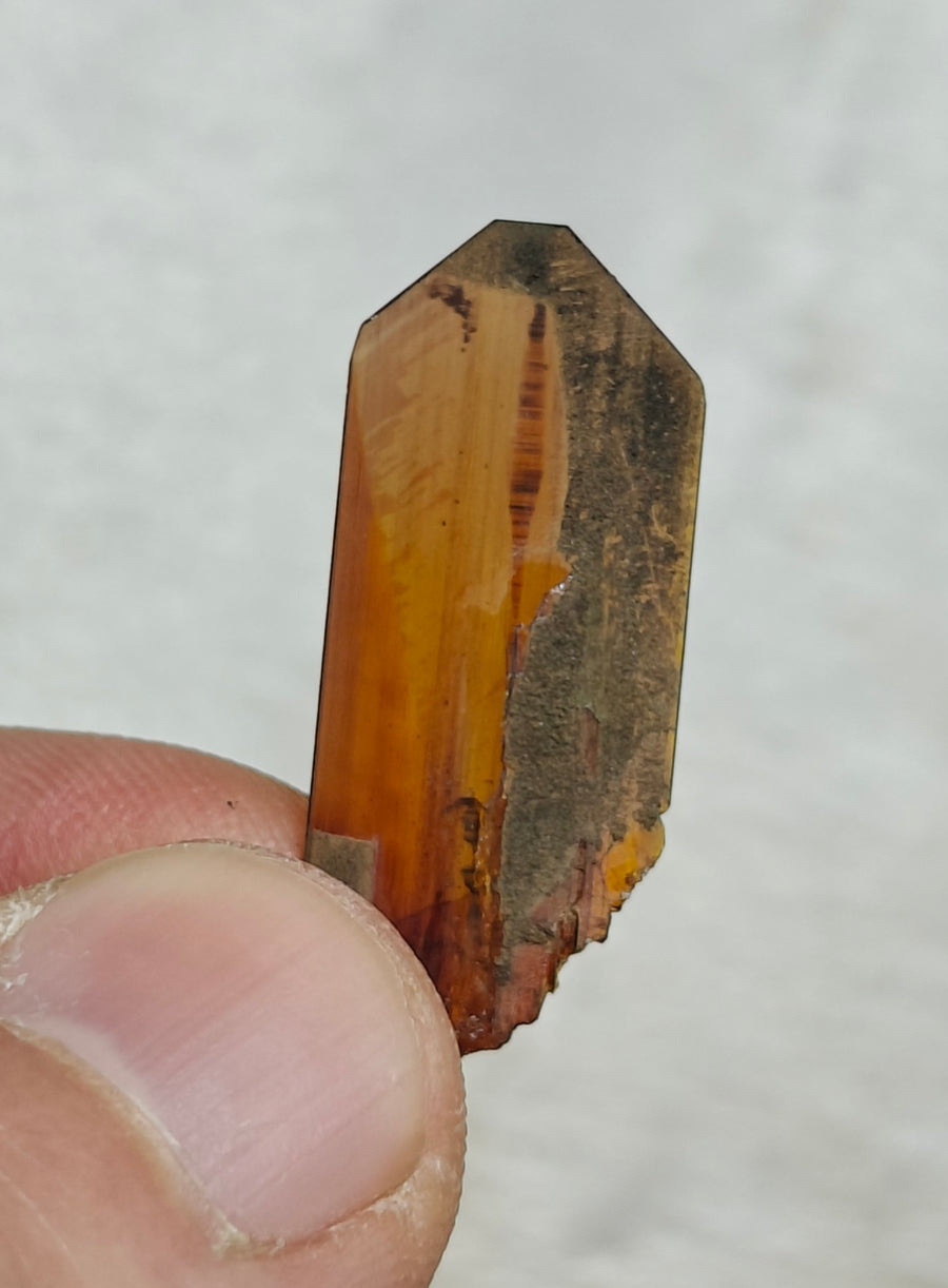 Natural amber-brown crystal specimen illustrating unusual mineral crystal forms