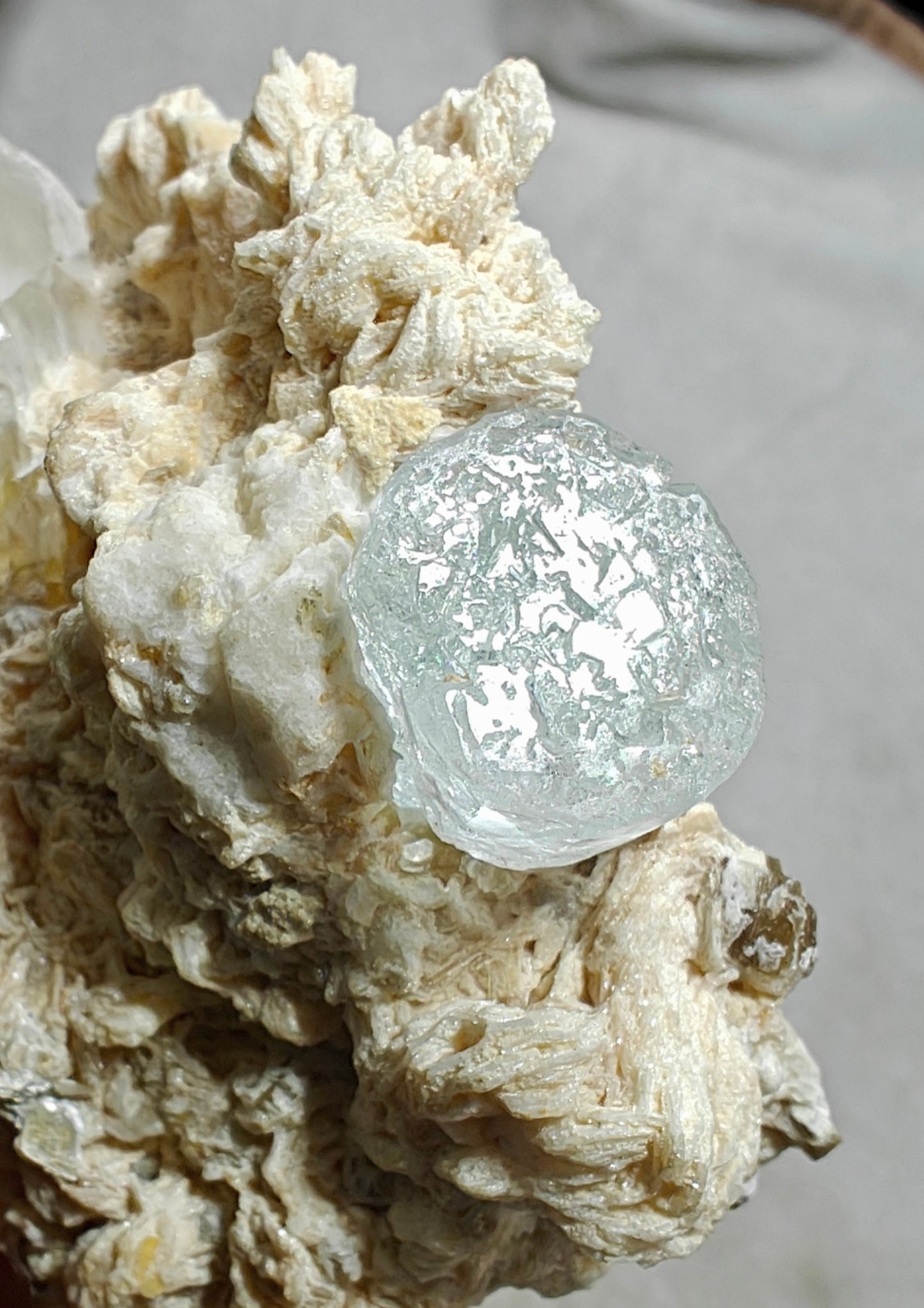An aesthetic Specimen of etched Aquamarine on matrix with quartz 206 grams