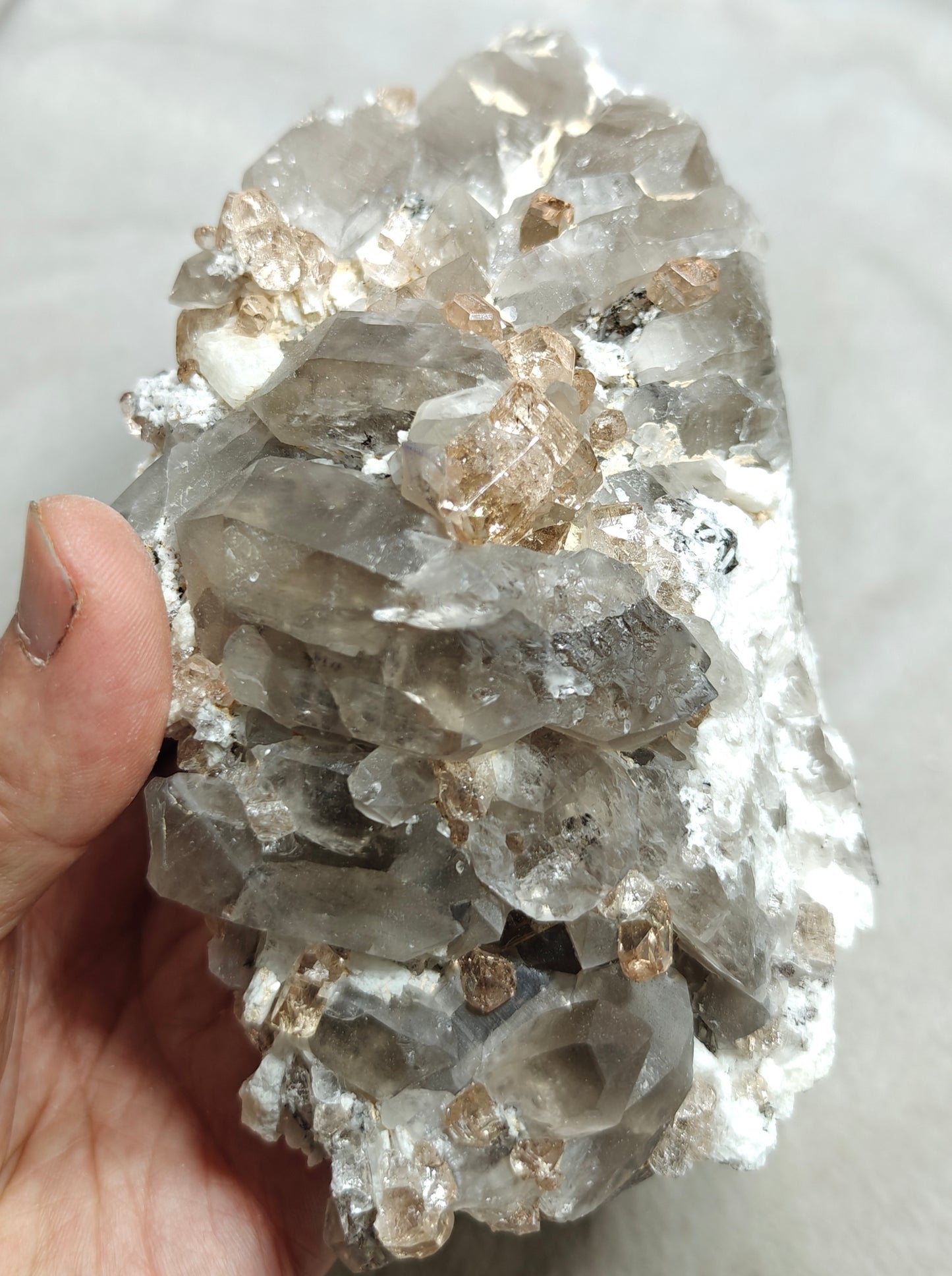 Natural terminated peach color Topaz crystals with smoky quartz on matrix 750 grams