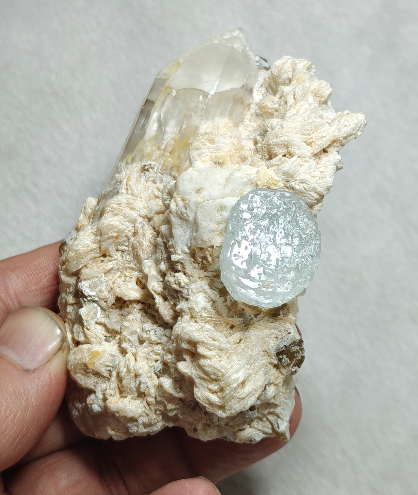 An aesthetic Specimen of etched Aquamarine on matrix with quartz 206 grams