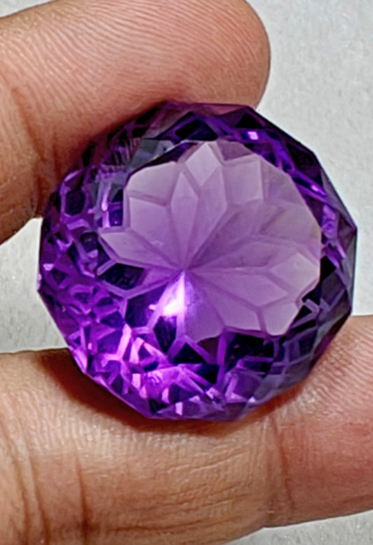 An amazing faceted fancy cut amethyst gemstone 77 carats