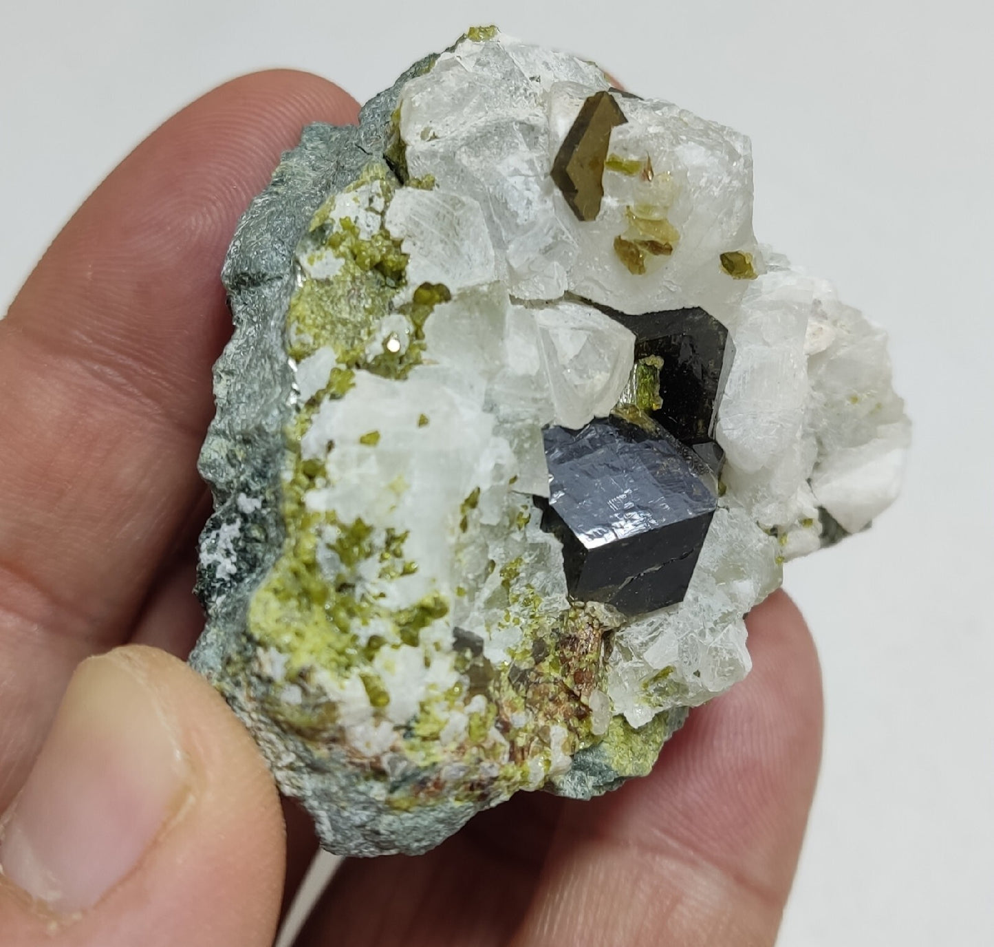 Andradite garnets on matrix with epidote and calcite 91 grams