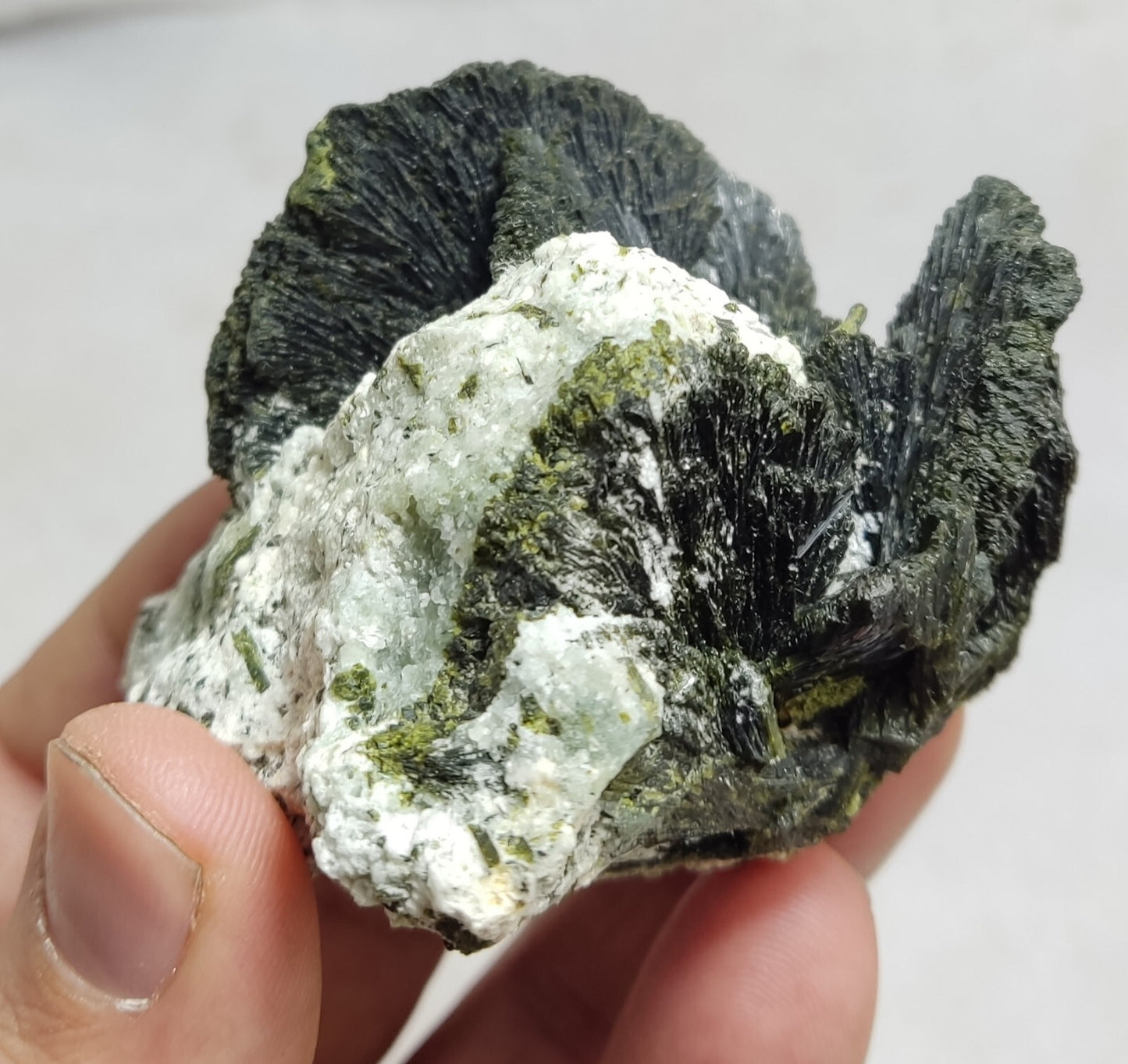 An aesthetic specimen of epidote crystal spray type on matrix 182 grams