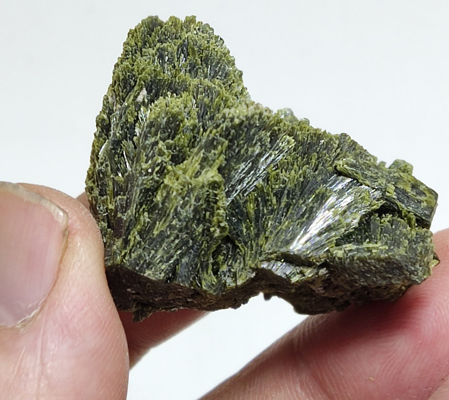 An aesthetic specimen of epidote crystal spray type 24 grams