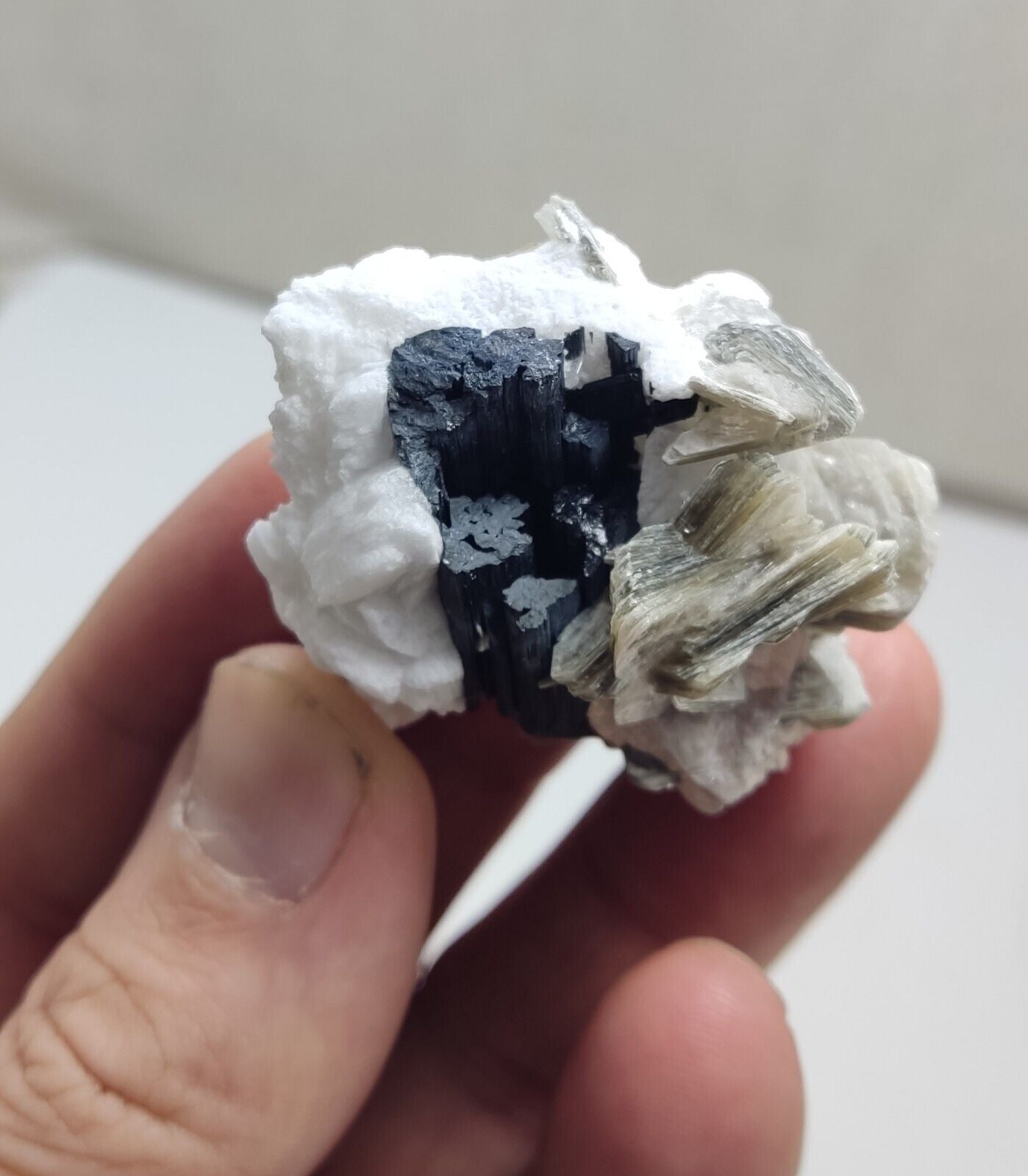 An Aesthetic specimen of muscovite with Tourmaline and albite 40 grams