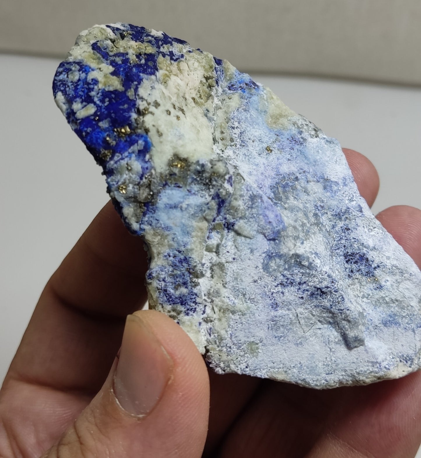 An Aesthetic specimen of fluorescent Lazurite with Pyrite 128 grams