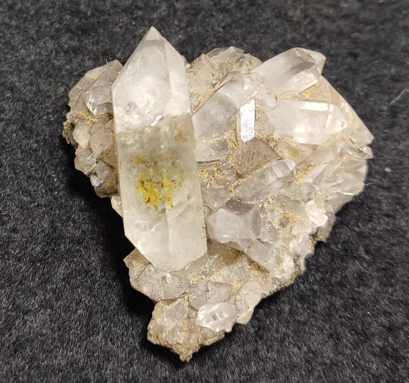 An Aesthetic quartz/calcite crystal specimen with petroleum inclusions 15 grams