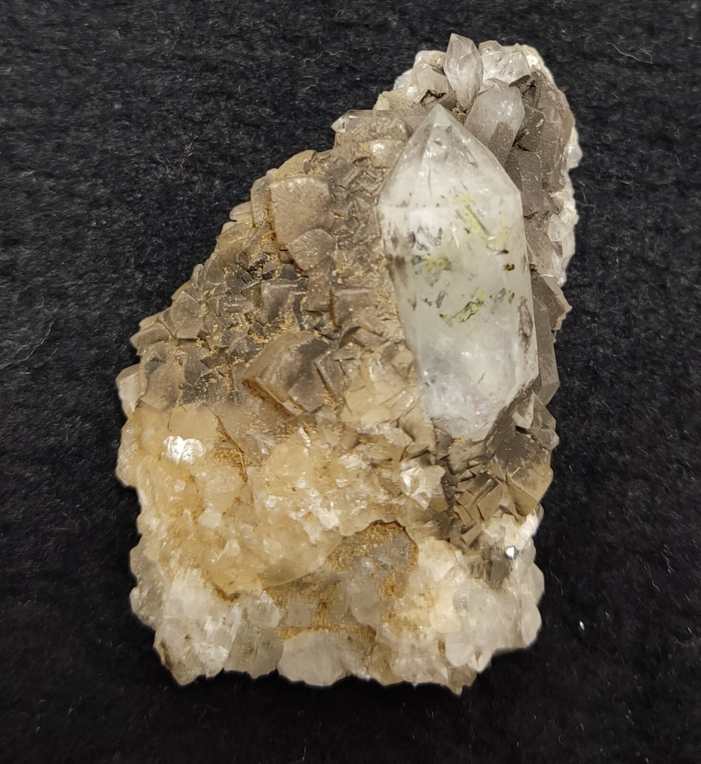 An Aesthetic quartz/calcite crystal specimen with petroleum inclusions 23 grams
