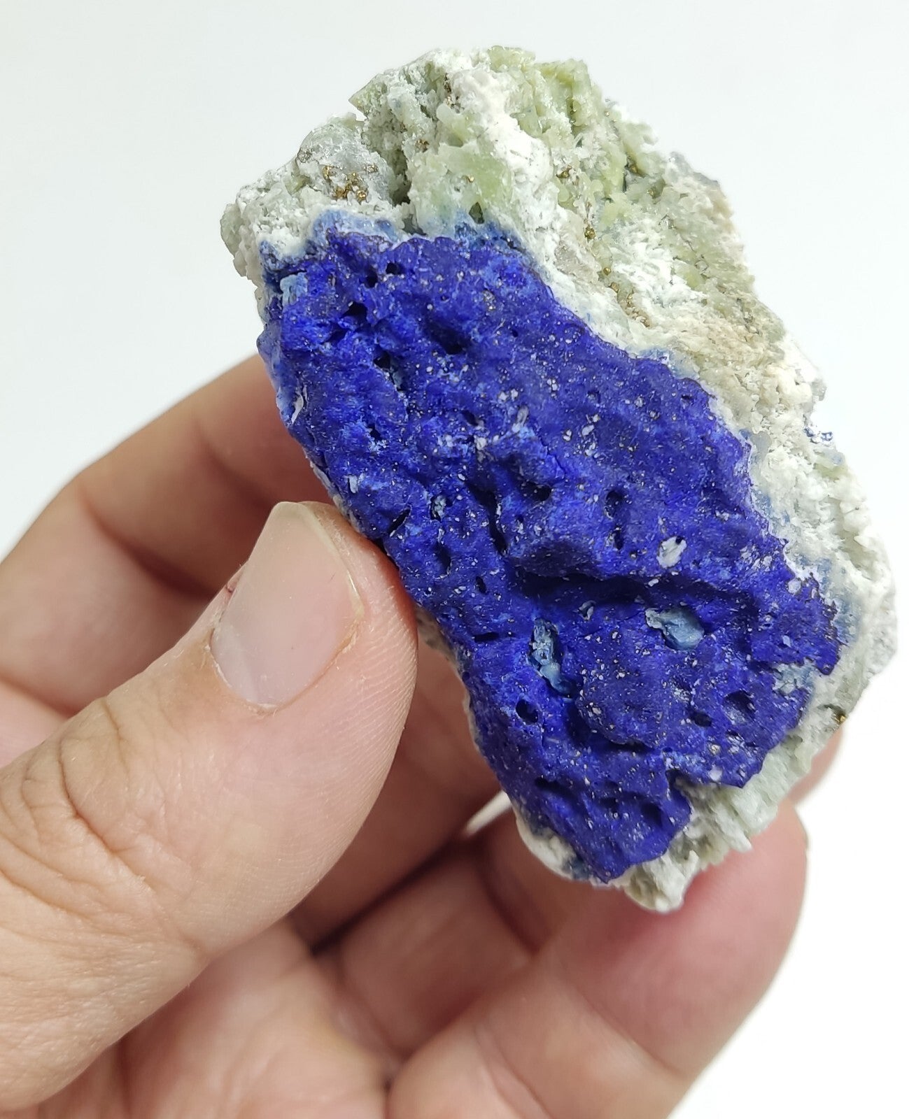 An Aesthetic specimen of fluorescent Lazurite with pyrite 181 grams