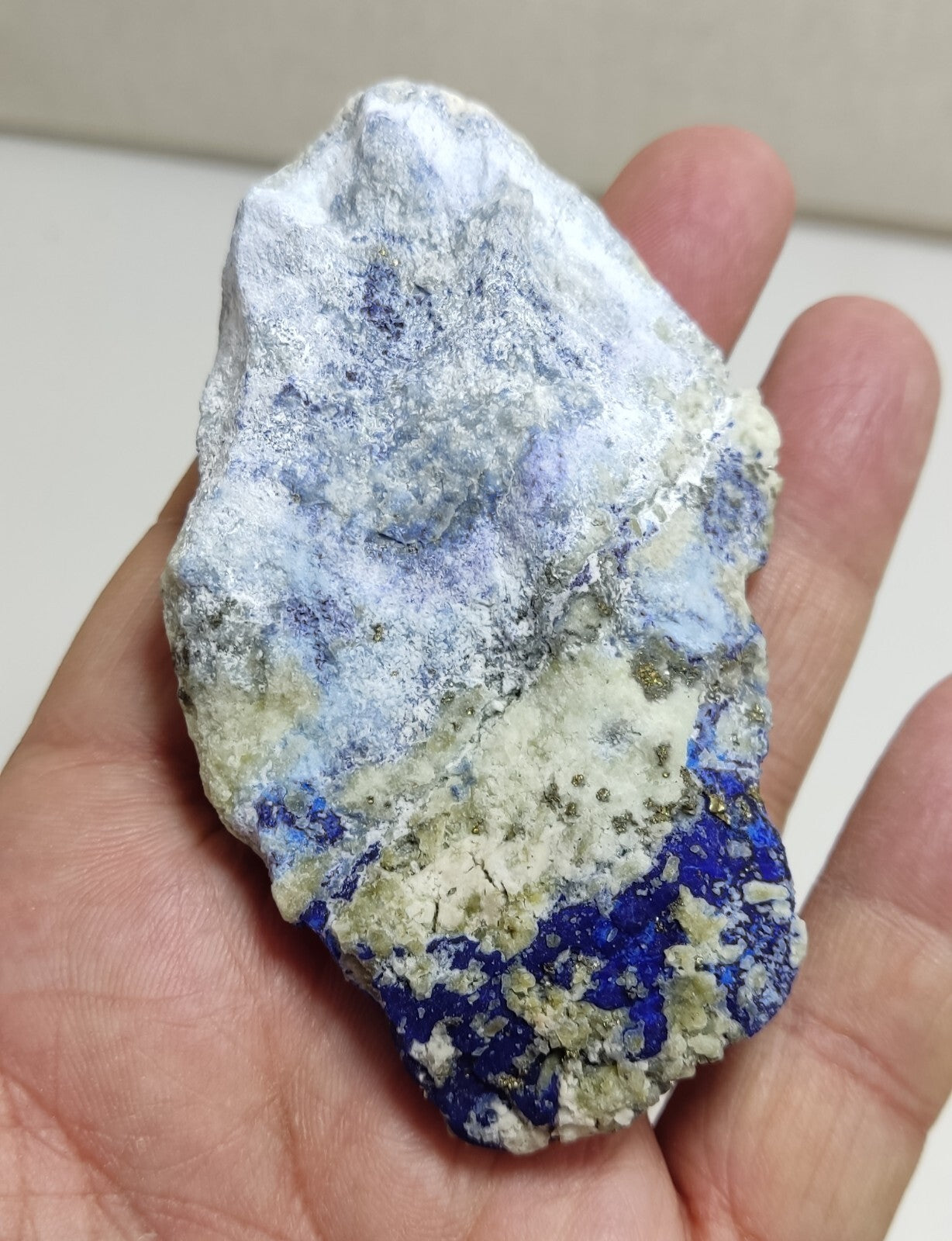 An Aesthetic specimen of fluorescent Lazurite with Pyrite 128 grams