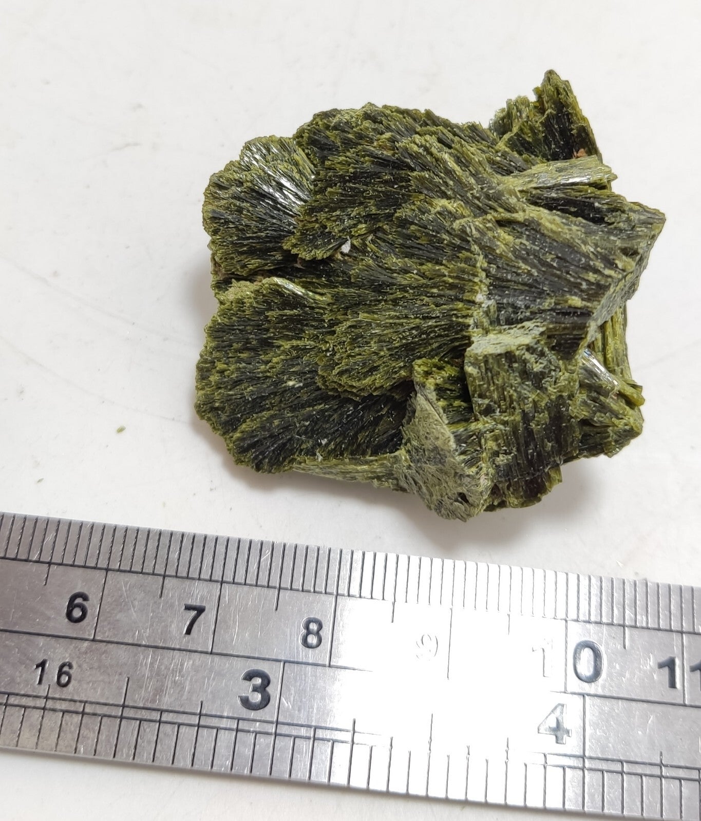 An aesthetic specimen of epidote crystal spray type 31 grams