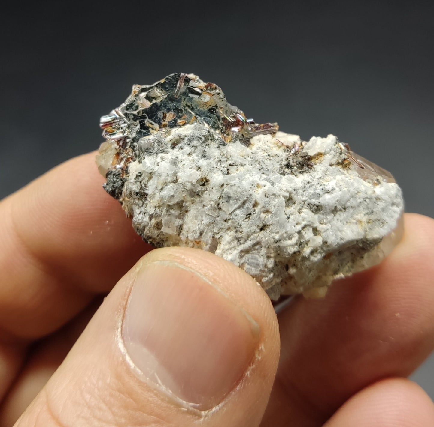 An Aesthetic specimen of quartz crystal with hematite and saginite 16 grams