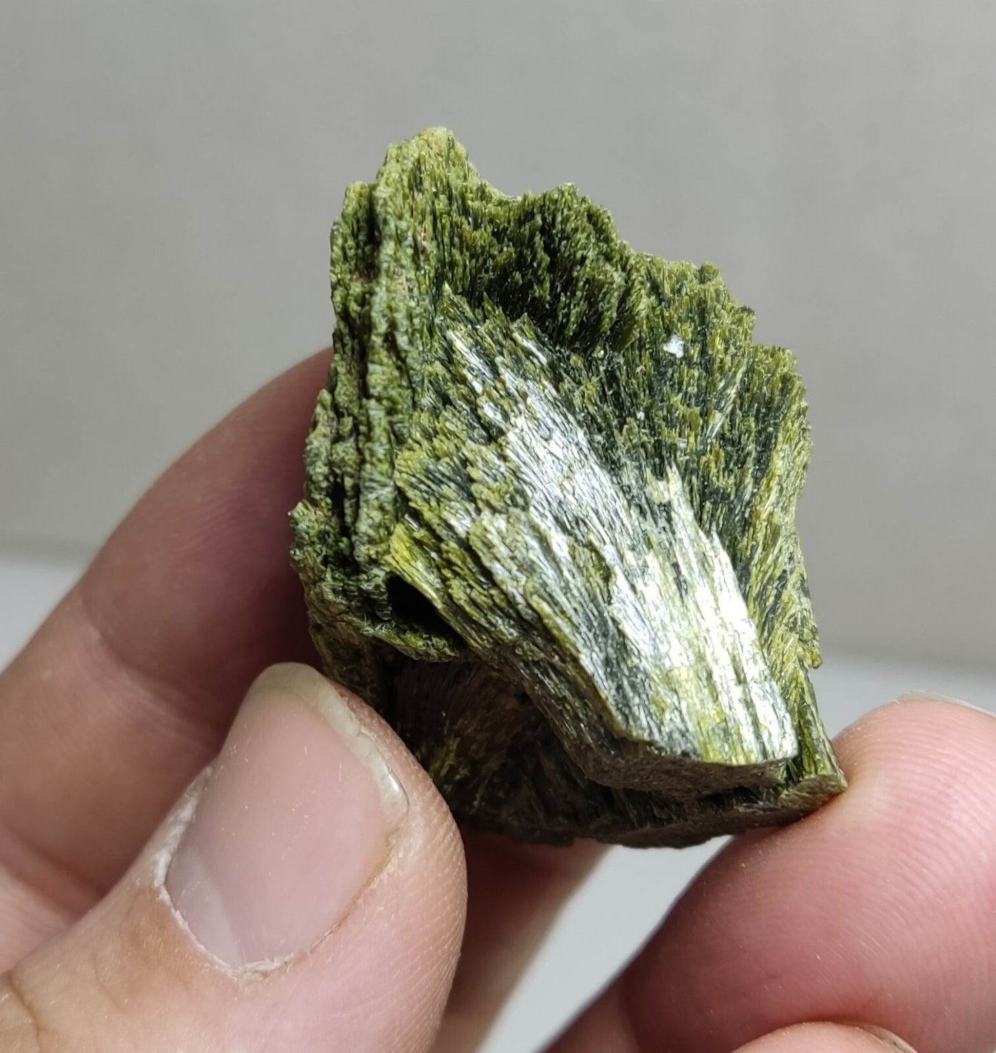 An aesthetic specimen of epidote crystal spray type 35 grams