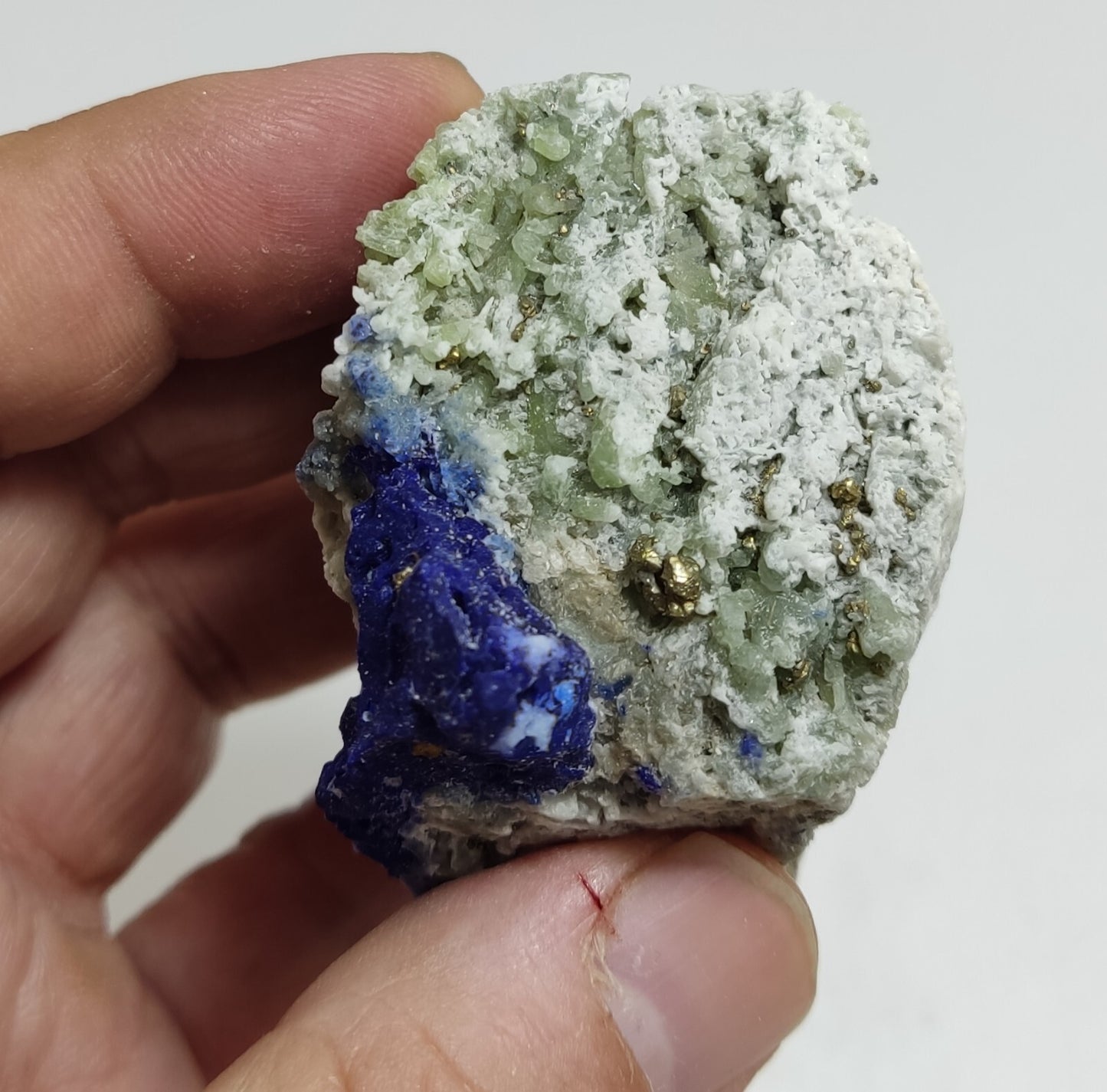 An Aesthetic specimen of fluorescent Lazurite with pyrite 181 grams