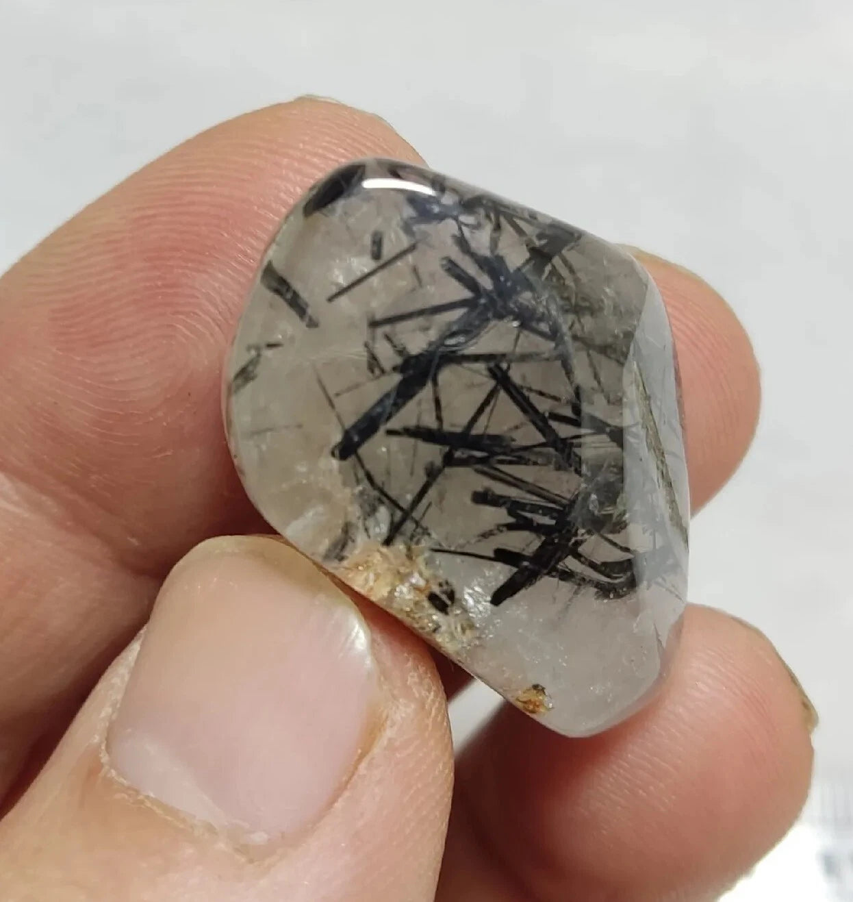 Rutiles/aegirine/ Unconfirmed quartz polished tumble 75 carats