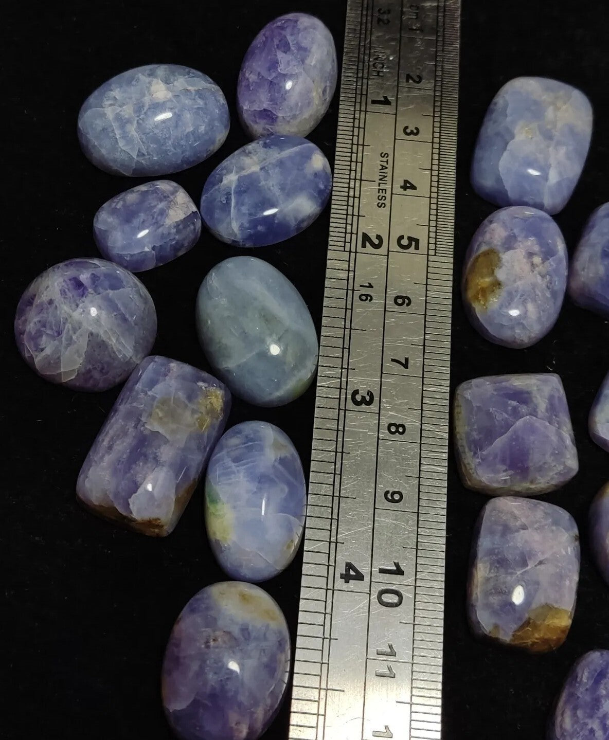 17 pieces Hackmanite cabochons  fluorescent collective weight 350 carats