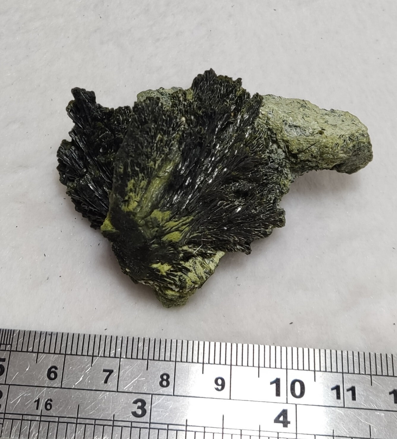 An aesthetic specimen of epidote crystal spray type 66 grams