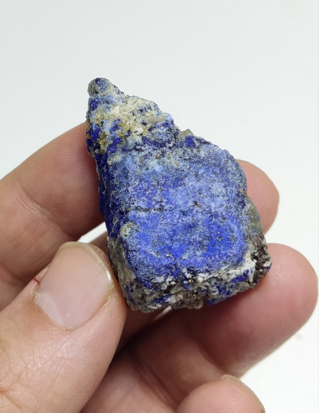 An Aesthetic specimen of fluorescent Lazurite with pyrite 27 grams