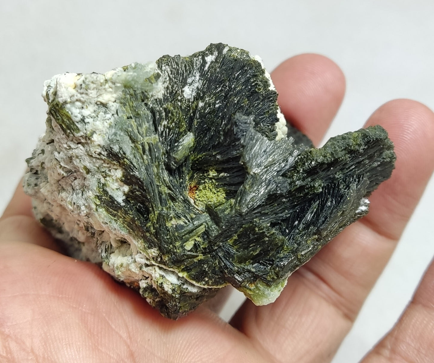 An aesthetic specimen of epidote crystal spray type on matrix 182 grams