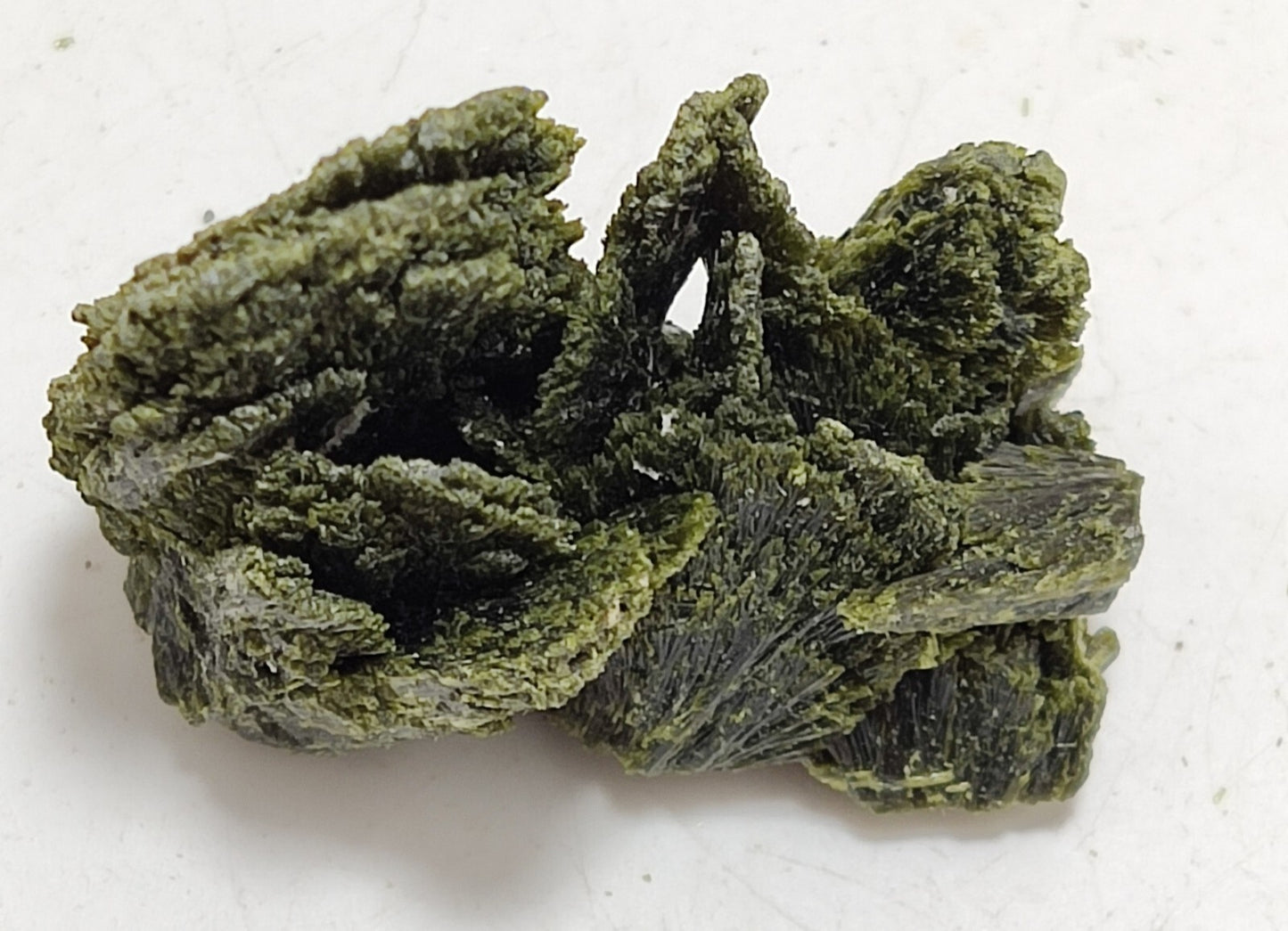 An aesthetic specimen of epidote crystal spray type 24 grams
