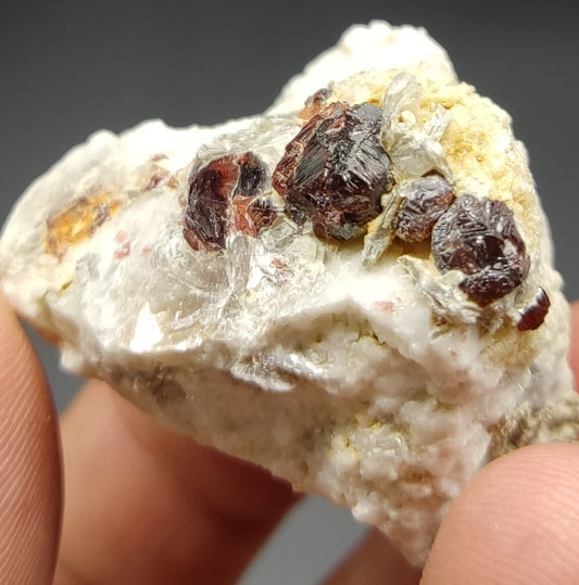 An aesthetic specimen of spessartine garnets on albite/feldspar 45 grams