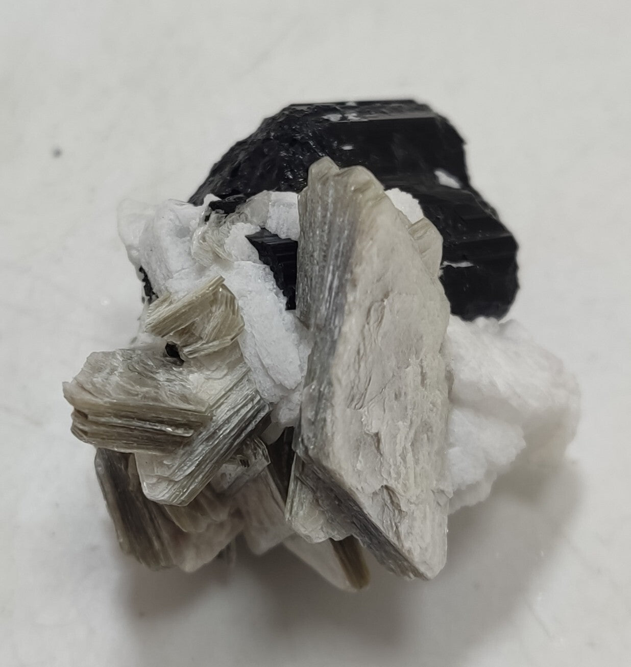 An Aesthetic specimen of muscovite with Tourmaline and albite 26 grams