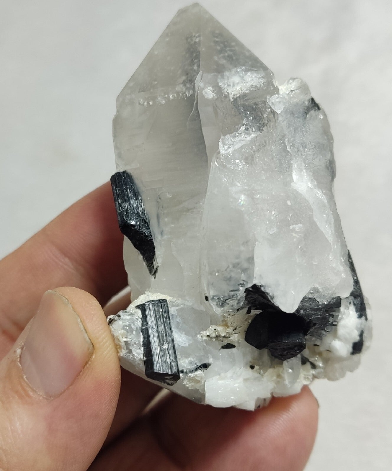 Natural quartz crystal with black tourmaline 145 grams