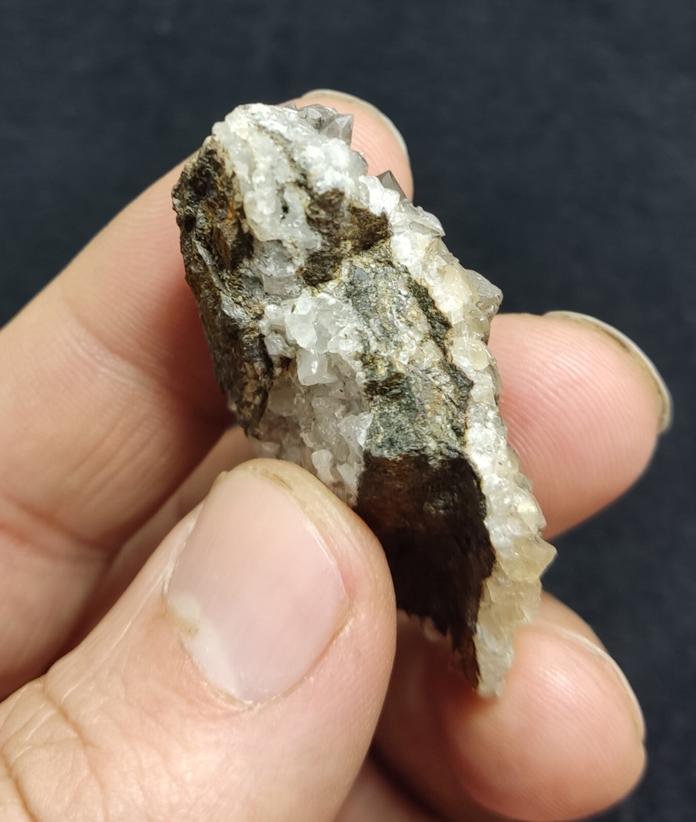 An Aesthetic quartz/calcite crystal specimen with petroleum inclusions 23 grams