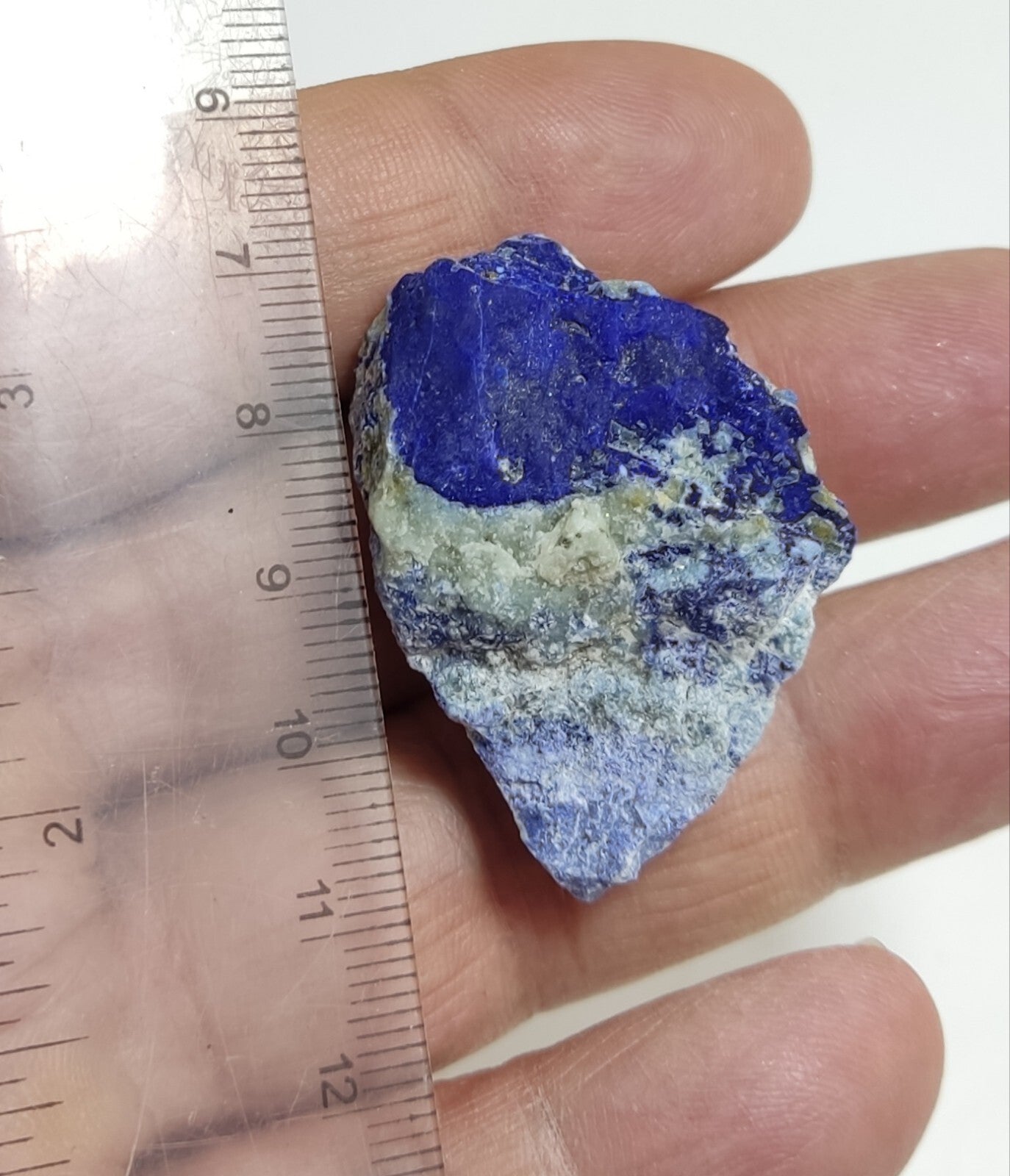 An Aesthetic specimen of fluorescent Lazurite with pyrite 25 grams