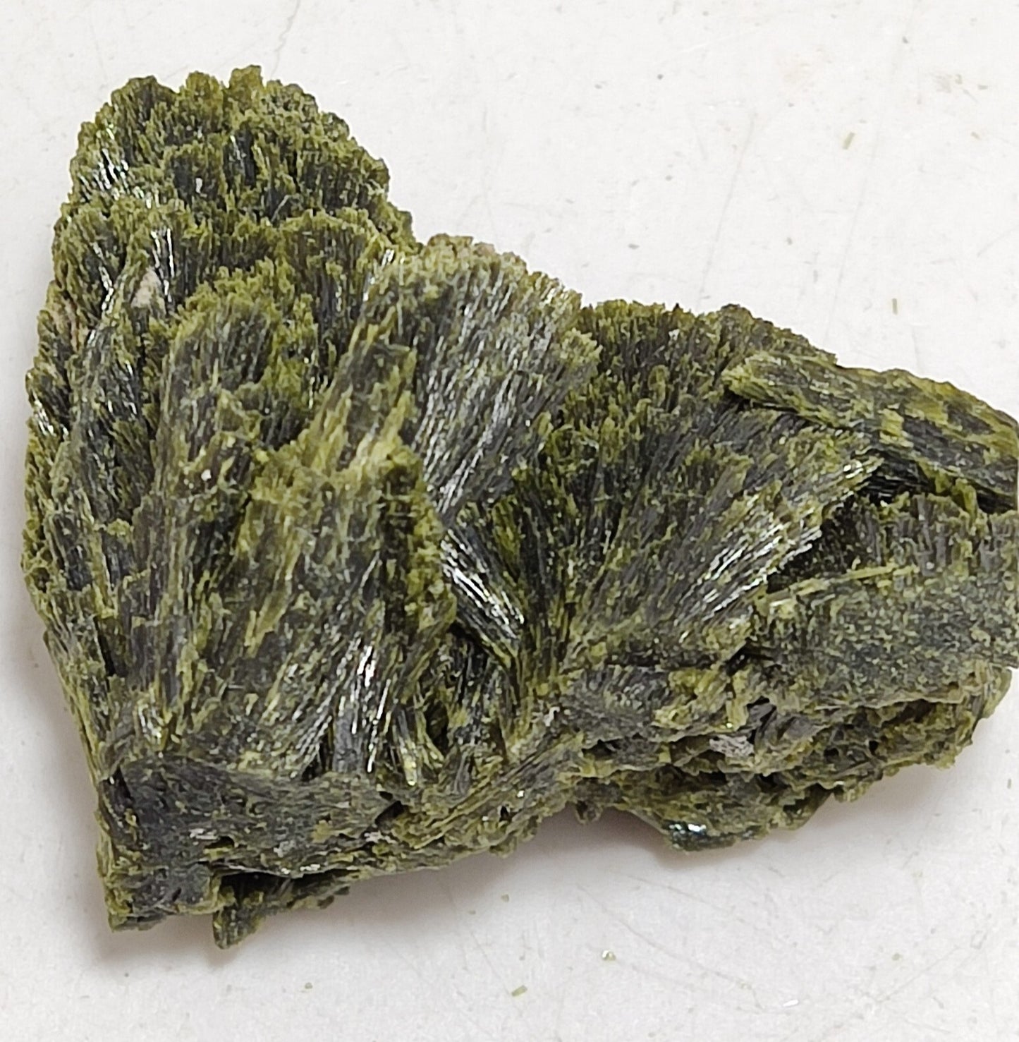 An aesthetic specimen of epidote crystal spray type 24 grams