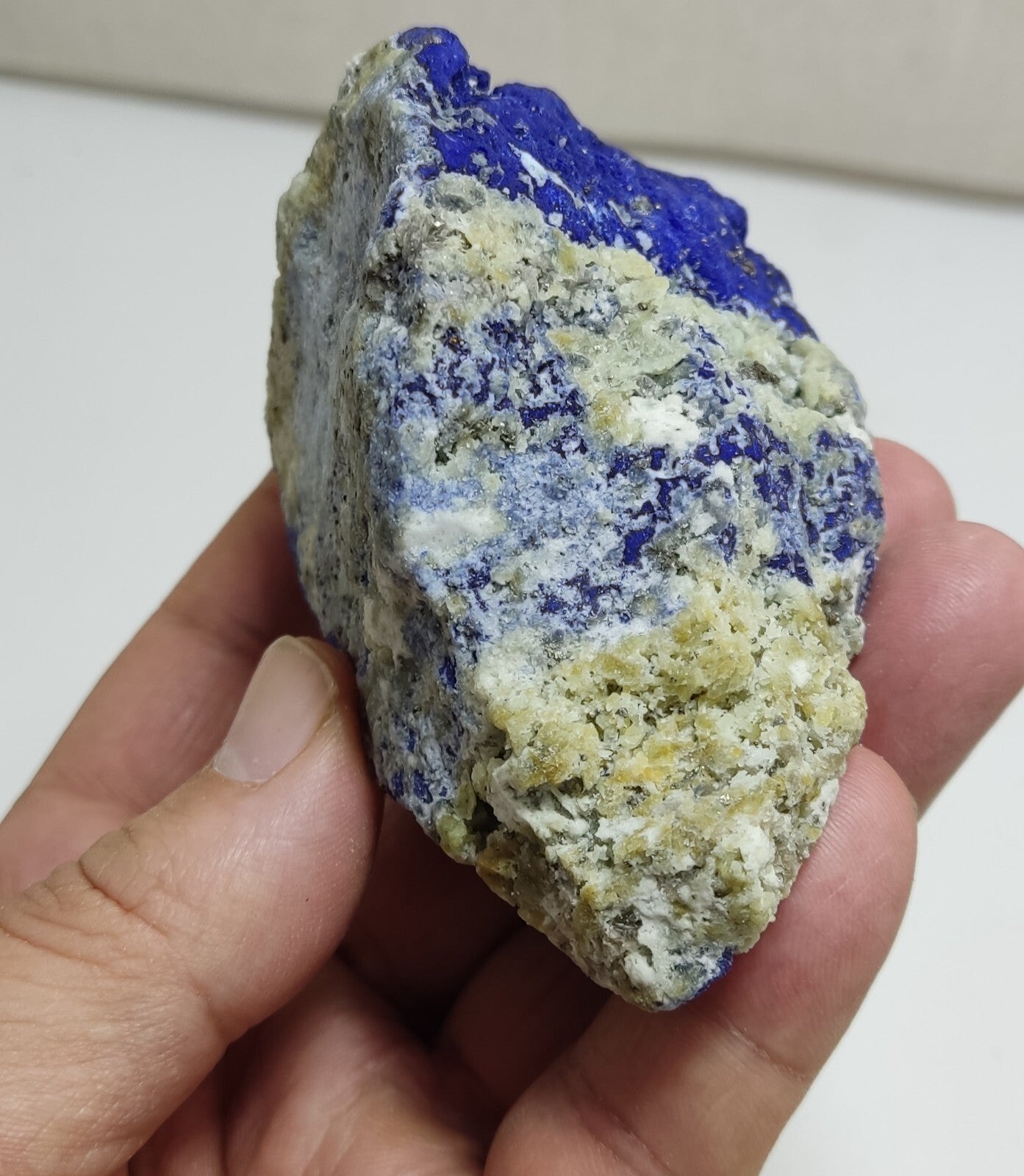 An Aesthetic specimen of fluorescent Lazurite with Pyrite 296 grams