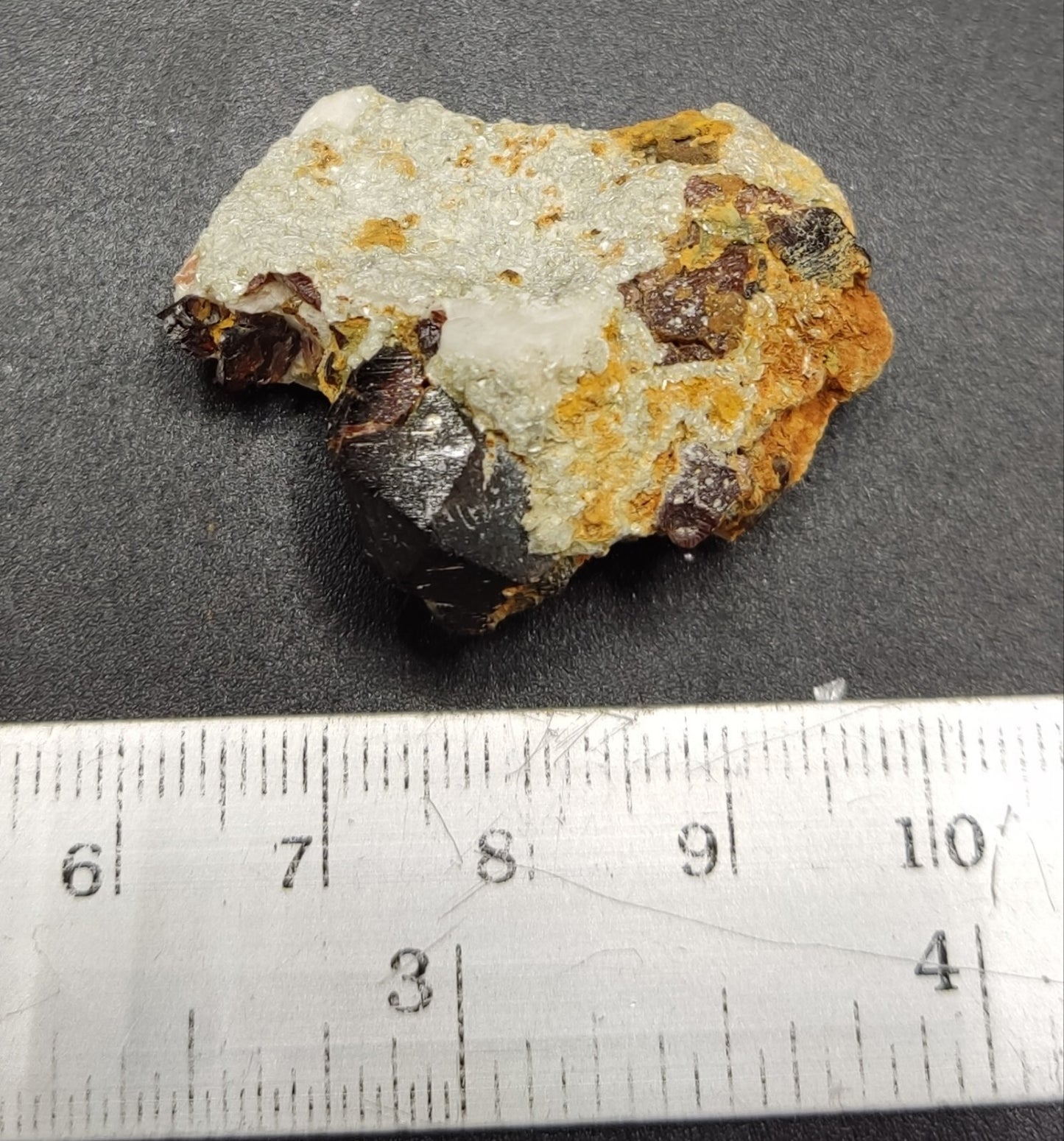 An aesthetic specimen of spessartine garnets on albite/feldspar 15 grams