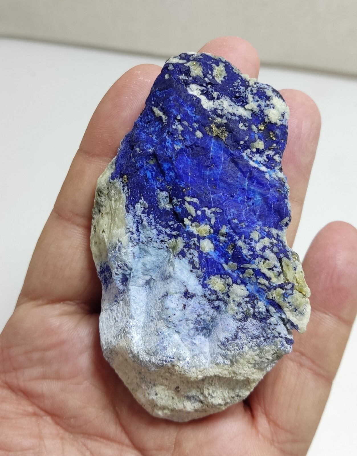 An Aesthetic specimen of fluorescent Lazurite with Pyrite 128 grams