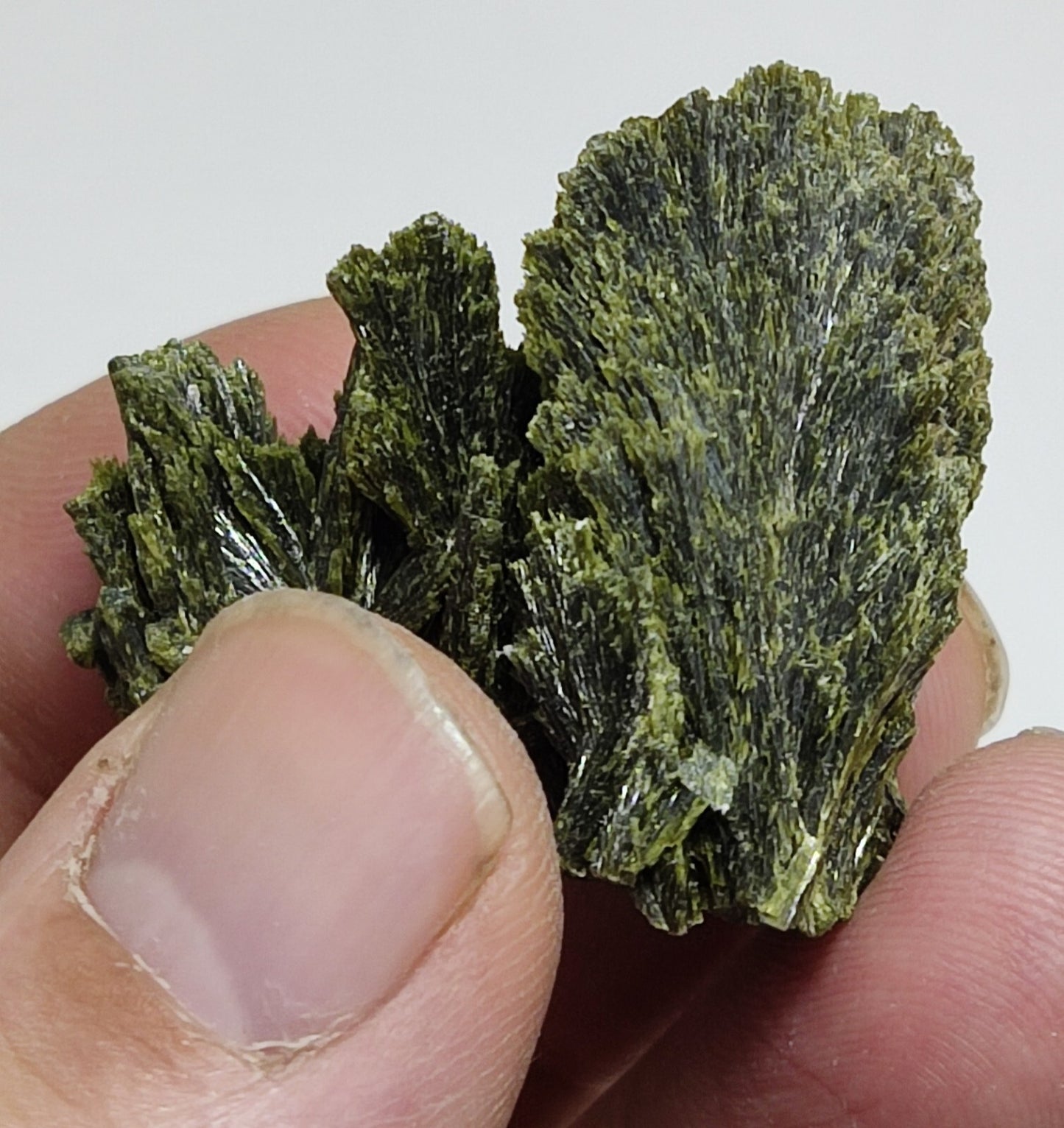 An aesthetic specimen of epidote crystal spray type 24 grams