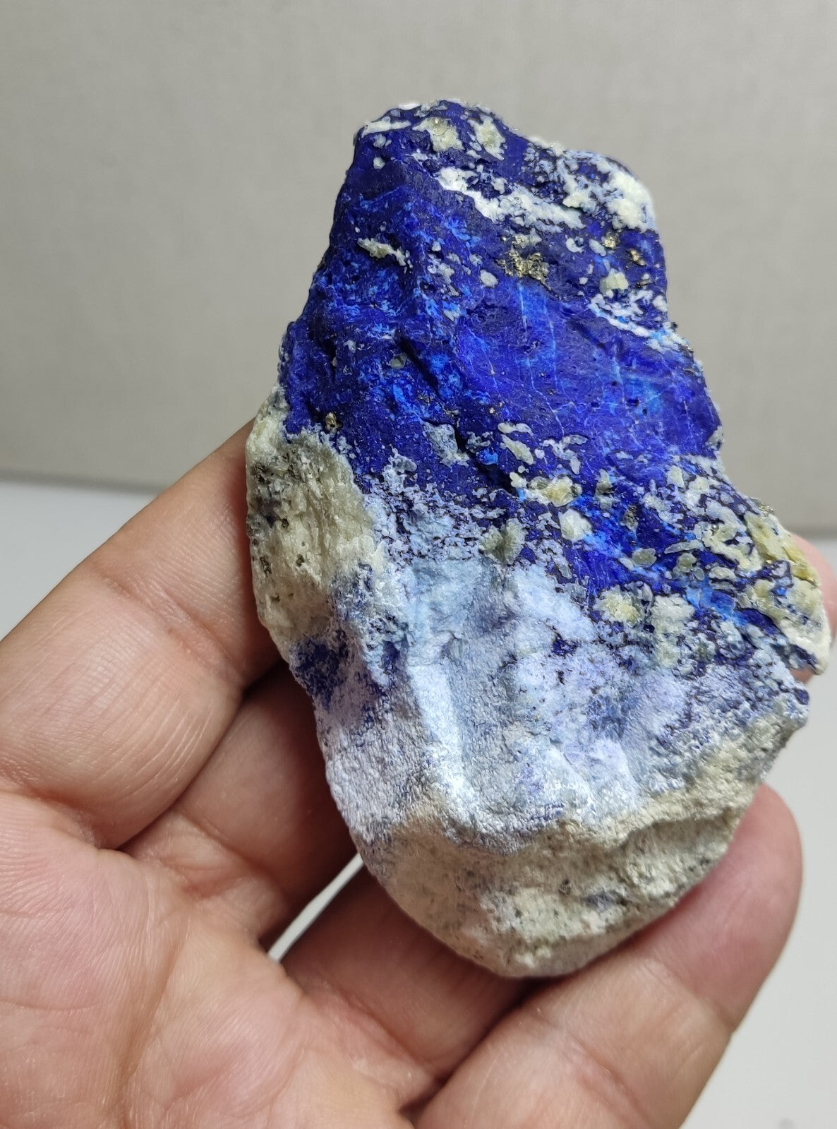 An Aesthetic specimen of fluorescent Lazurite with Pyrite 128 grams